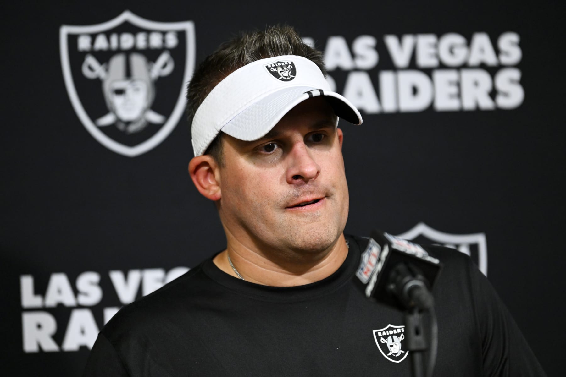 Las Vegas Raiders head coach Josh McDaniels answers questions after an NFL football game against the Tennessee Titans Sunday, Sept. 25, 2022, in Nashville, Tenn. (AP Photo/John Amis)