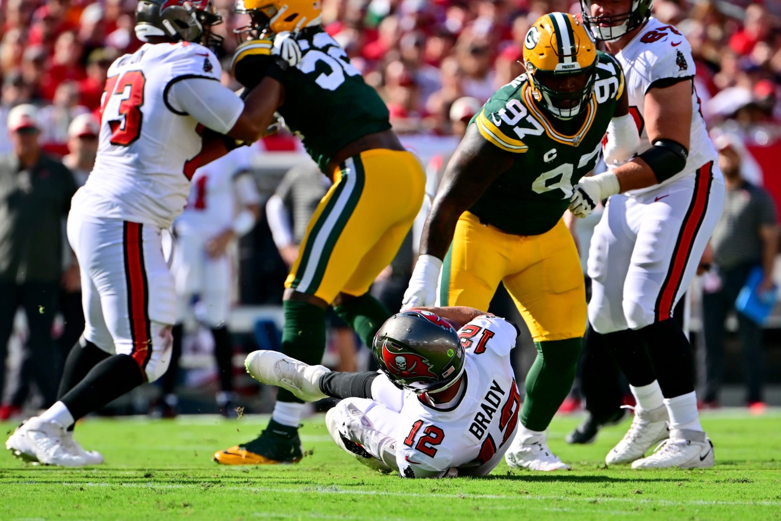 TAMPA, FLORIDA - SEPTEMBER 25: Zach Triner #97 of the Tampa Bay Buccaneers sacks Tom Brady #12 of the Tampa Bay Buccaneers during the first quarter in the game at Raymond James Stadium on September 25, 2022 in Tampa, Florida. (Photo by Julio Aguilar/Getty Images)