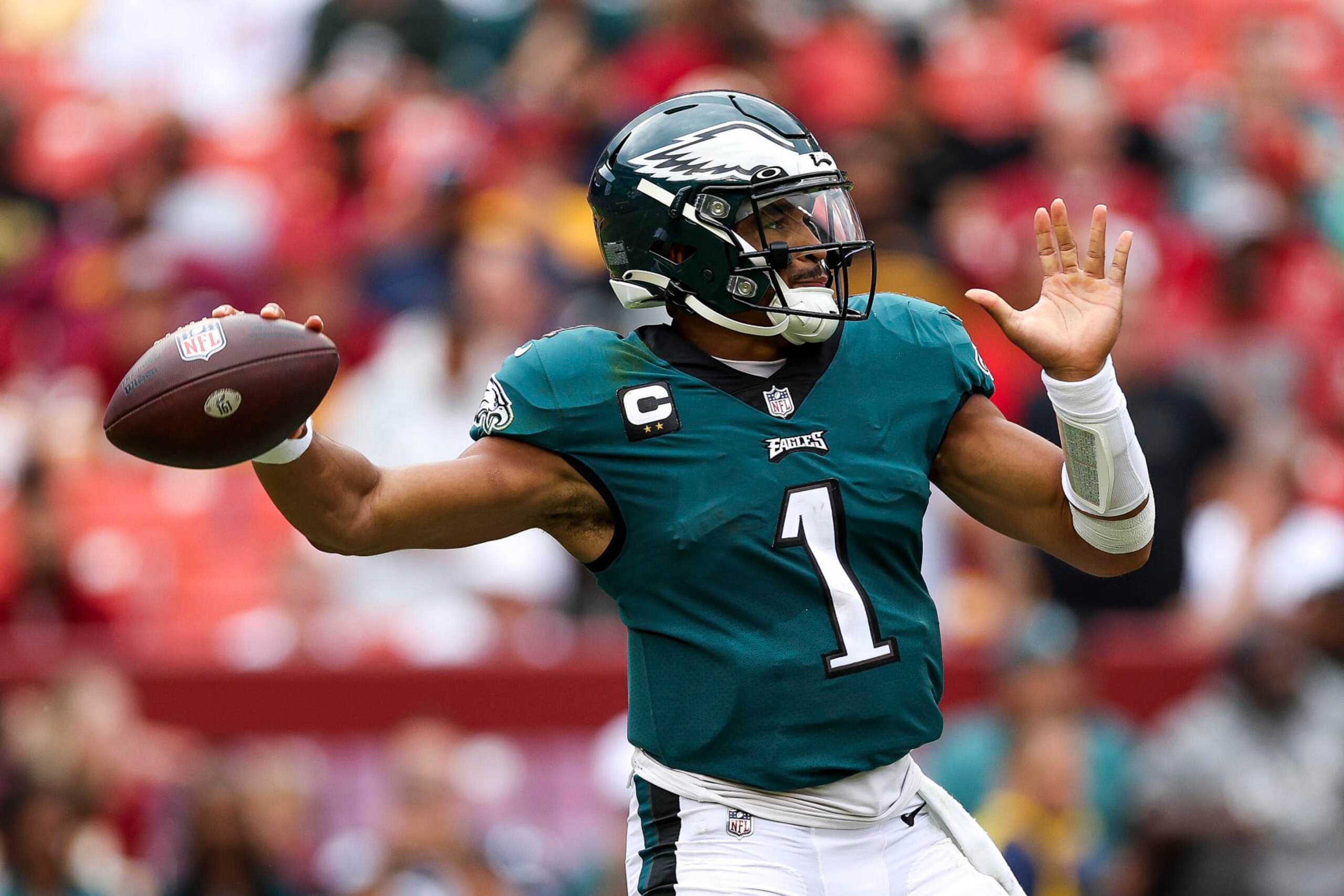LANDOVER, MARYLAND - SEPTEMBER 25: Quarterback Jalen Hurts #1 of the Philadelphia Eagles attempts a pass against the Washington Commanders at FedExField on September 25, 2022 in Landover, Maryland. (Photo by Patrick Smith/Getty Images)