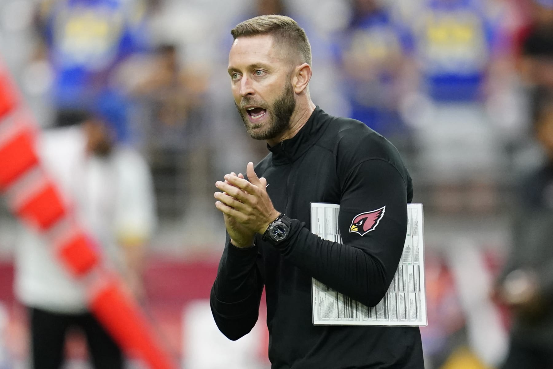 Arizona Cardinals head coach Kliff Kingsbury motions before an NFL football game against the Los Angeles Rams, Sunday, Sept. 25, 2022, in Glendale, Ariz. (AP Photo/Ross D. Franklin)