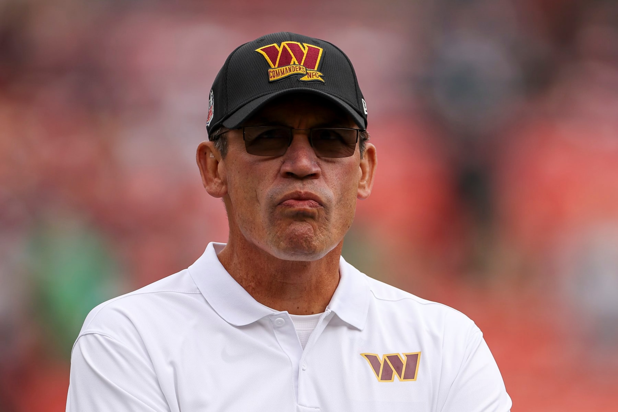LANDOVER, MARYLAND - SEPTEMBER 25: Head coach Ron Rivera of the Washington Commanders looks onward during pregame at FedExField on September 25, 2022 in Landover, Maryland. (Photo by Scott Taetsch/Getty Images) LANDOVER, MARYLAND - SEPTEMBER 25: Head coach Ron Rivera of the Washington Commanders looks onward during pregame at FedExField on September 25, 2022 in Landover, Maryland. (Photo by Scott Taetsch/Getty Images)