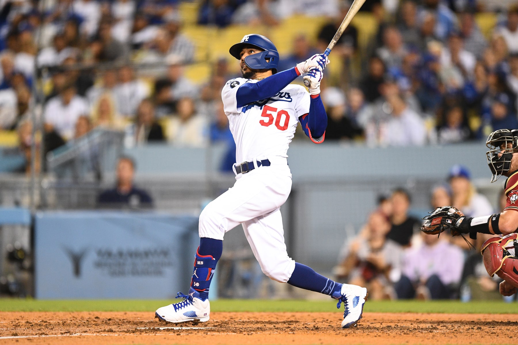 LOS ANGELES, CA - SEPTEMBER 21: Los Angeles Dodgers right fielder Mookie Betts (50) swings at a pitch during the MLB game between the Arizona Diamondbacks and the Los Angeles Dodgers on September 21, 2022 at Dodger Stadium in Los Angeles, CA. (Photo by Brian Rothmuller/Icon Sportswire via Getty Images)