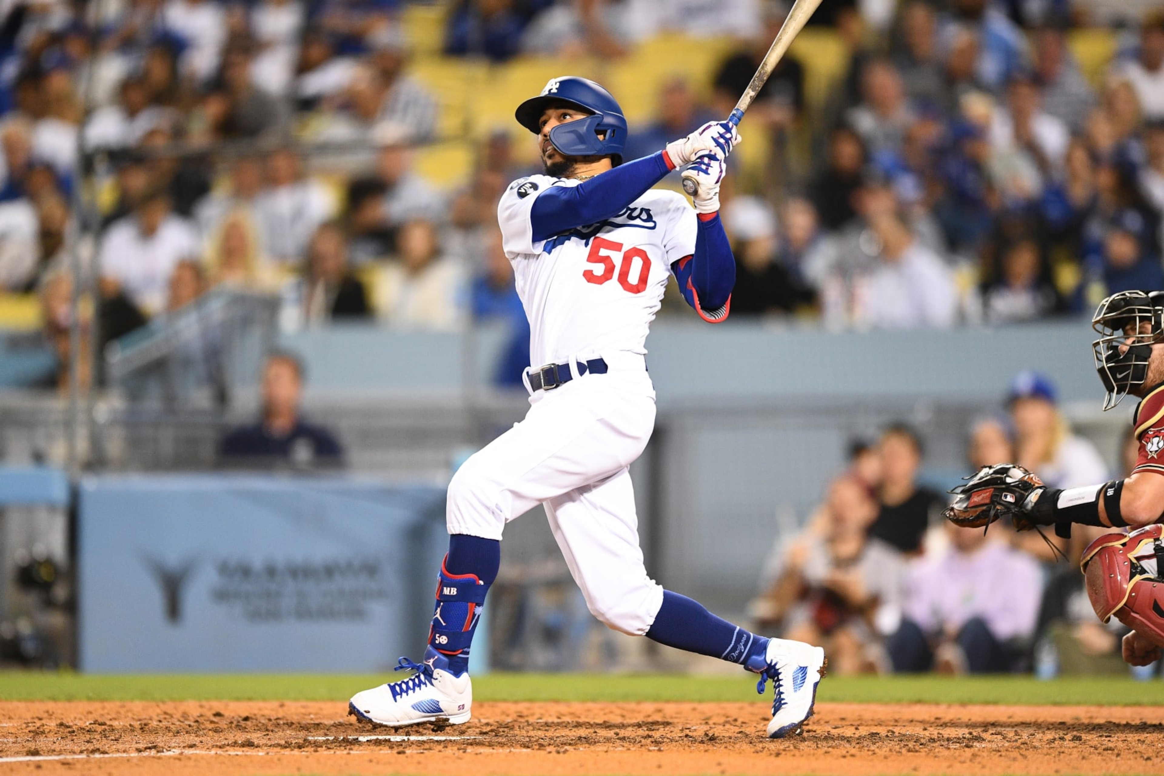 LOS ANGELES, CA - SEPTEMBER 21: Los Angeles Dodgers right fielder Mookie Betts (50) swings at a pitch during the MLB game between the Arizona Diamondbacks and the Los Angeles Dodgers on September 21, 2022 at Dodger Stadium in Los Angeles, CA. (Photo by Brian Rothmuller/Icon Sportswire via Getty Images) LOS ANGELES, CA - SEPTEMBER 21: Los Angeles Dodgers right fielder Mookie Betts (50) swings at a pitch during the MLB game between the Arizona Diamondbacks and the Los Angeles Dodgers on September 21, 2022 at Dodger Stadium in Los Angeles, CA. (Photo by Brian Rothmuller/Icon Sportswire via Getty Images)