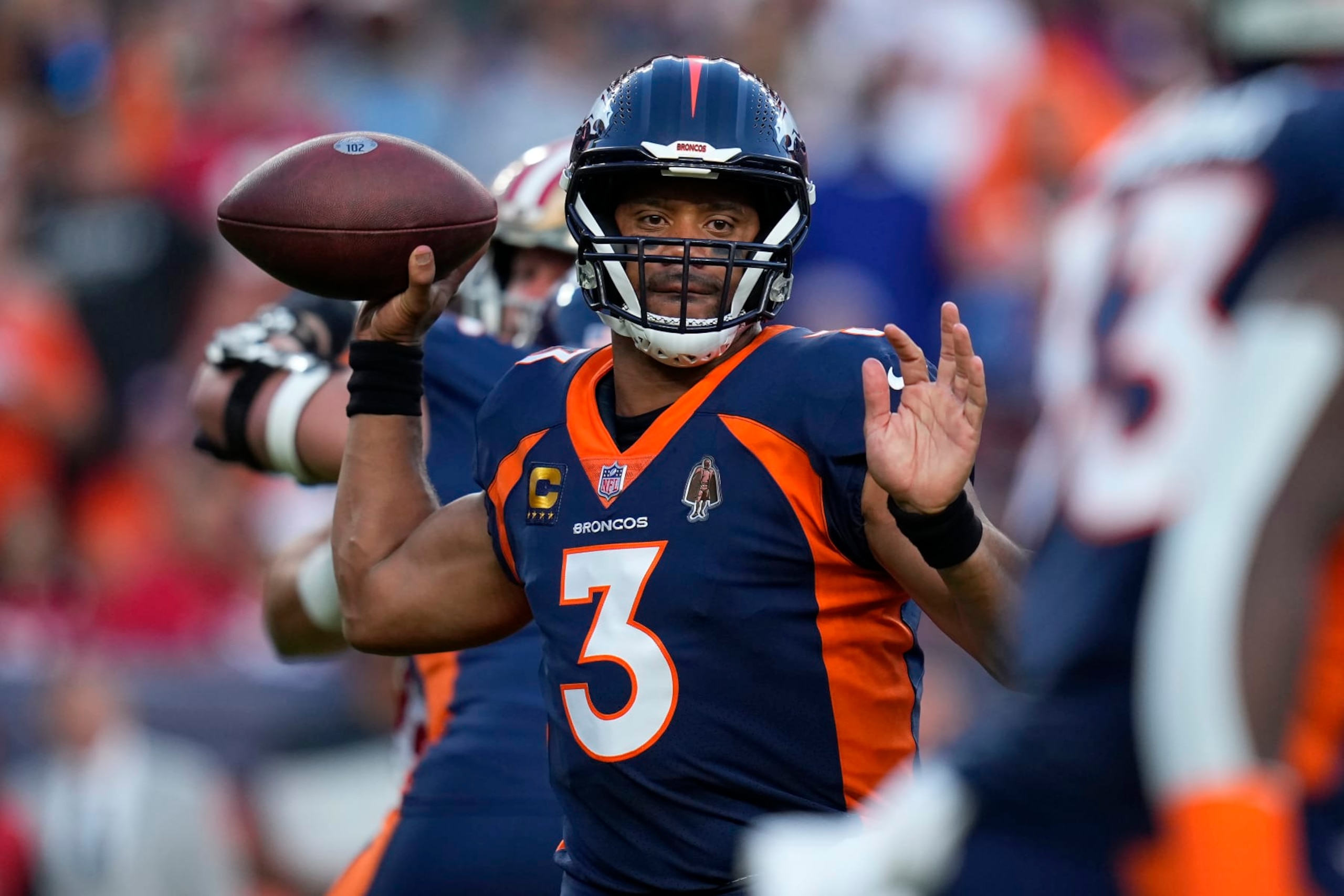 Denver Broncos quarterback Russell Wilson (3) passes against the San Francisco 49ers during the first half of an NFL football game in Denver, Sunday, Sept. 25, 2022. (AP Photo/Jack Dempsey)