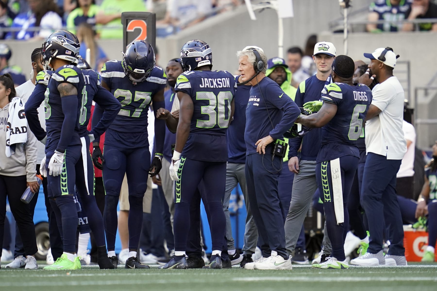 Seattle Seahawks head coach Pete Carroll, center right, looks on as players are asked to vacate the field as part of a security timeout during the second half of an NFL football game against the Atlanta Falcons, Sunday, Sept. 25, 2022, in Seattle. (AP Photo/Ashley Landis)