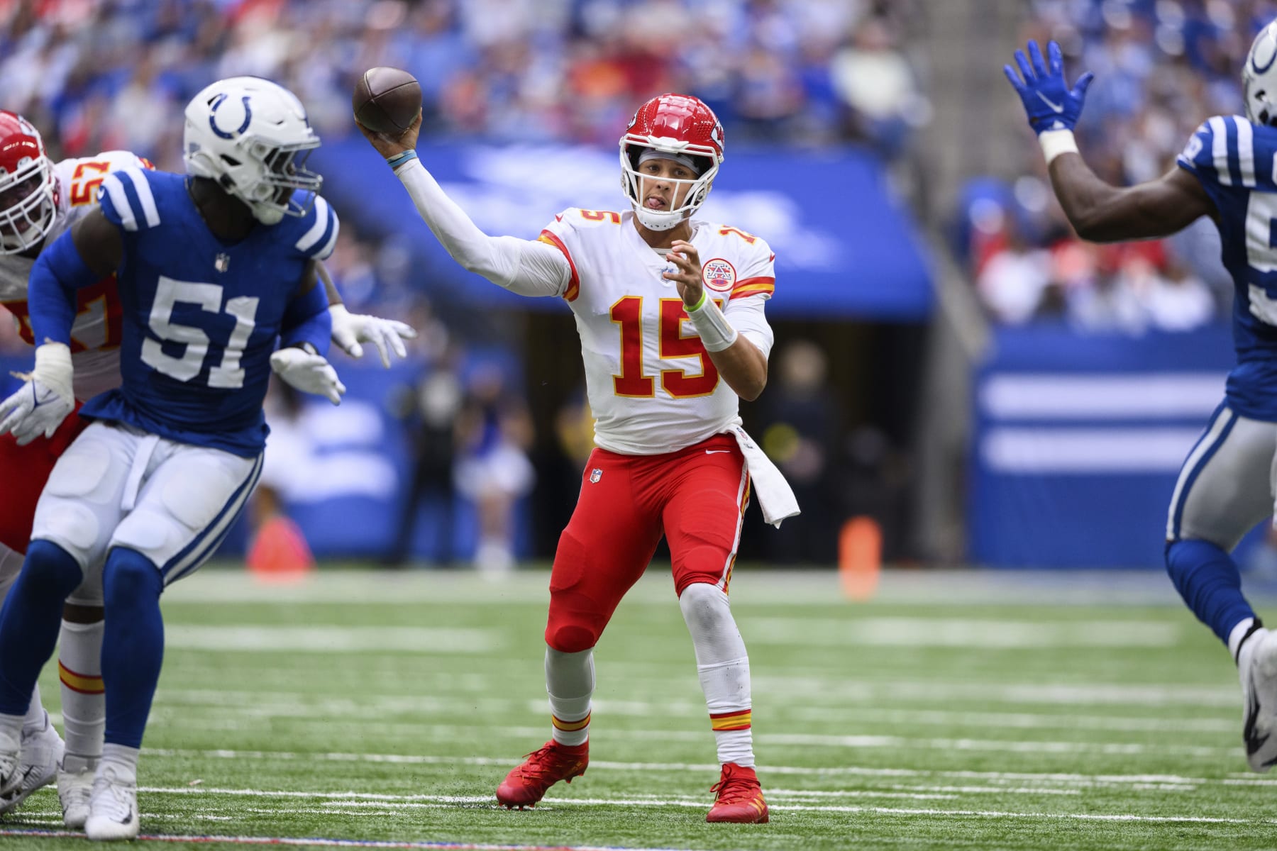 Kansas City Chiefs quarterback Patrick Mahomes (15) throws downfield during an NFL football game against the Indianapolis Colts, Sunday, Sept. 25, 2022, in Indianapolis. (AP Photo/Zach Bolinger)