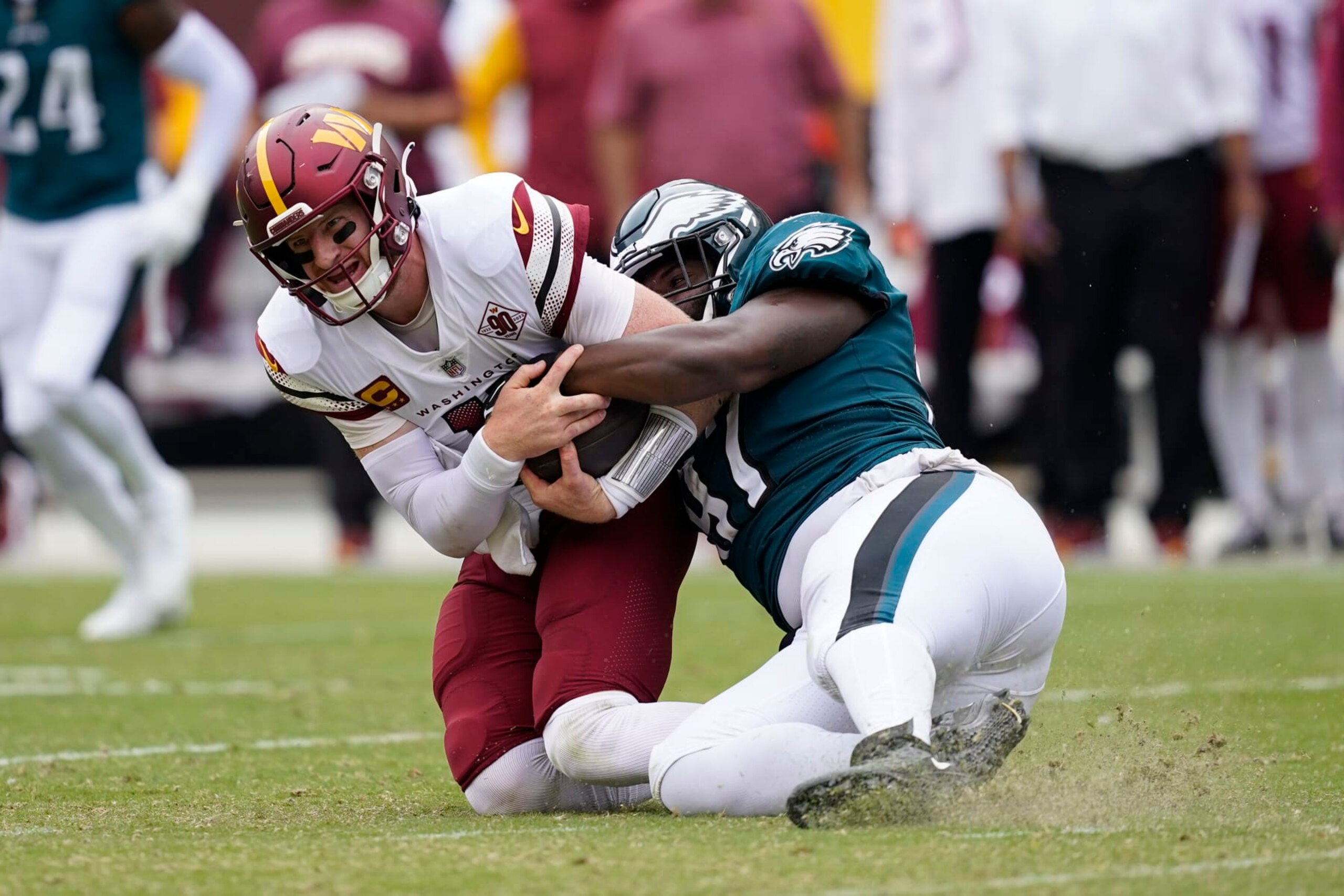 Philadelphia Eagles defensive tackle Javon Hargrave (97) pulls down Washington Commanders quarterback Carson Wentz (11) during the second half of an NFL football game, Sunday, Sept. 25, 2022, in Landover, Md. (AP Photo/Alex Brandon) Philadelphia Eagles defensive tackle Javon Hargrave (97) pulls down Washington Commanders quarterback Carson Wentz (11) during the second half of an NFL football game, Sunday, Sept. 25, 2022, in Landover, Md. (AP Photo/Alex Brandon)