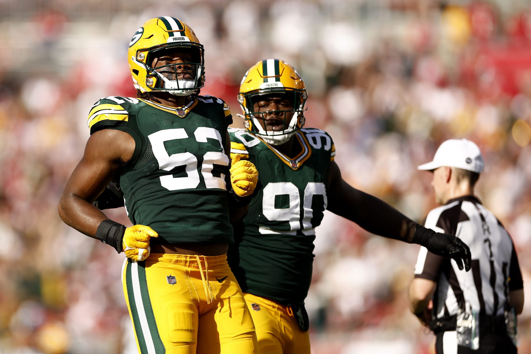 TAMPA, FLORIDA - SEPTEMBER 25: Rashan Gary #52 of the Green Bay Packers celebrates with Jarran Reed #90 after sacking Tom Brady #12 of the Tampa Bay Buccaneers during the second quarter in the game at Raymond James Stadium on September 25, 2022 in Tampa, Florida. (Photo by Douglas P. DeFelice/Getty Images)