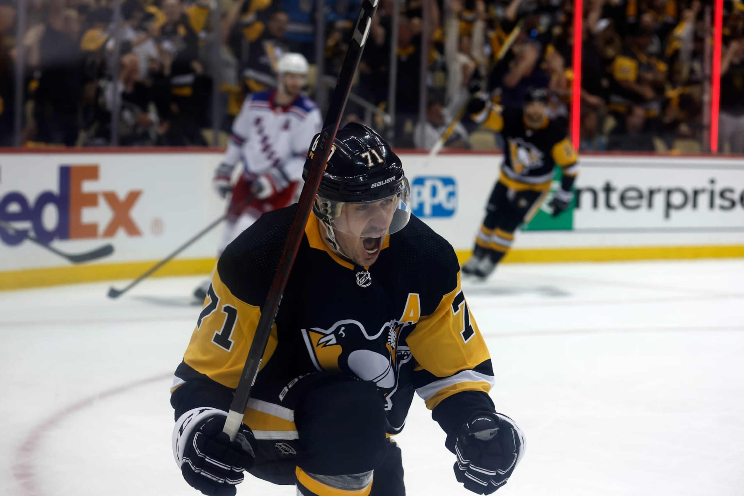 PITTSBURGH, PA - MAY 13:  Evgeni Malkin #71 of the Pittsburgh Penguins reacts after scoring a goal in Game Six of the First Round of the 2022 Stanley Cup Playoffs against the New York Rangers at PPG PAINTS Arena on May 13, 2022 in Pittsburgh, Pennsylvania. (Photo by Kirk Irwin/Getty Images)