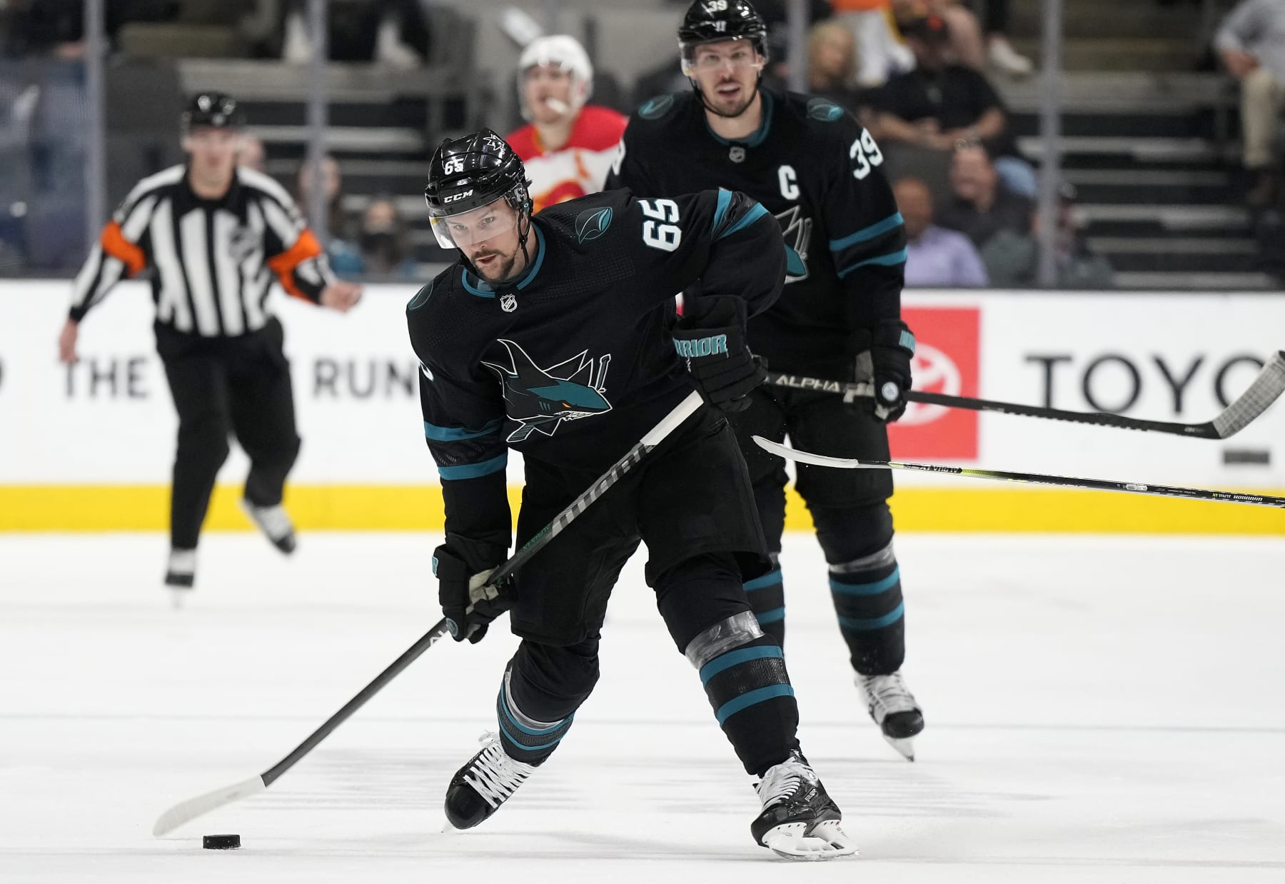 SAN JOSE, CALIFORNIA - APRIL 07: Erik Karlsson #65 of the San Jose Sharks shoots on goal against the Calgary Flames during the second period of an NHL hockey game at SAP Center on April 07, 2022 in San Jose, California. (Photo by Thearon W. Henderson/Getty Images)