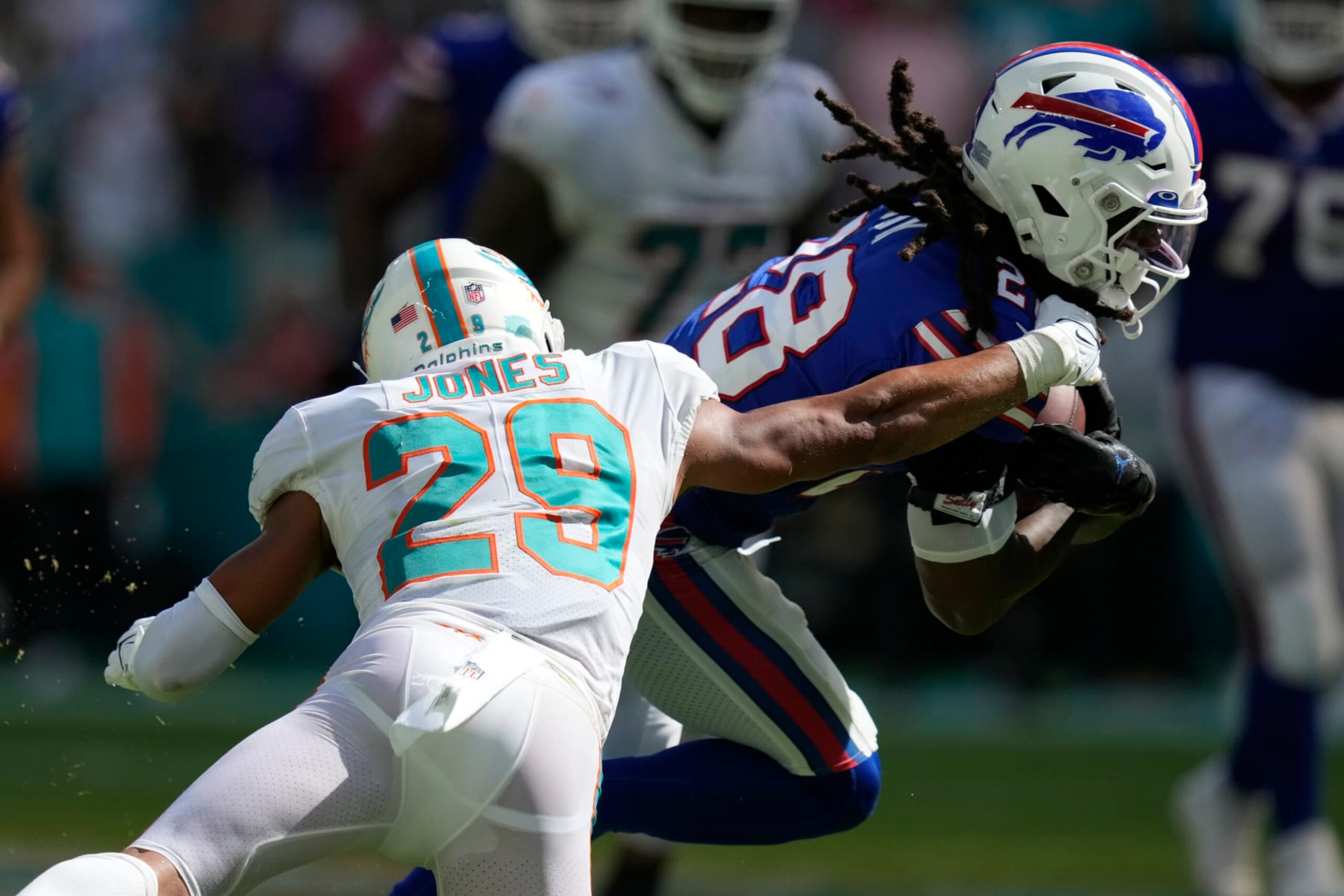 Miami Dolphins safety Brandon Jones (29) grabs Buffalo Bills running back James Cook (28) during the second half of an NFL football game, Sunday, Sept. 25, 2022, in Miami Gardens, Fla. (AP Photo/Rebecca Blackwell) Miami Dolphins safety Brandon Jones (29) grabs Buffalo Bills running back James Cook (28) during the second half of an NFL football game, Sunday, Sept. 25, 2022, in Miami Gardens, Fla. (AP Photo/Rebecca Blackwell)
