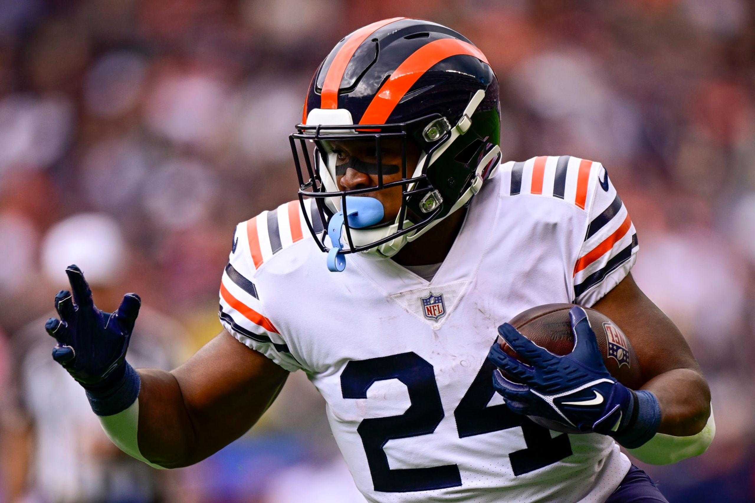 CHICAGO, ILLINOIS - SEPTEMBER 25: Running back Khalil Herbert #24 of the Chicago Bears runs for a touchdown during the first quarter at Soldier Field on September 25, 2022 in Chicago, Illinois. (Photo by Quinn Harris/Getty Images)