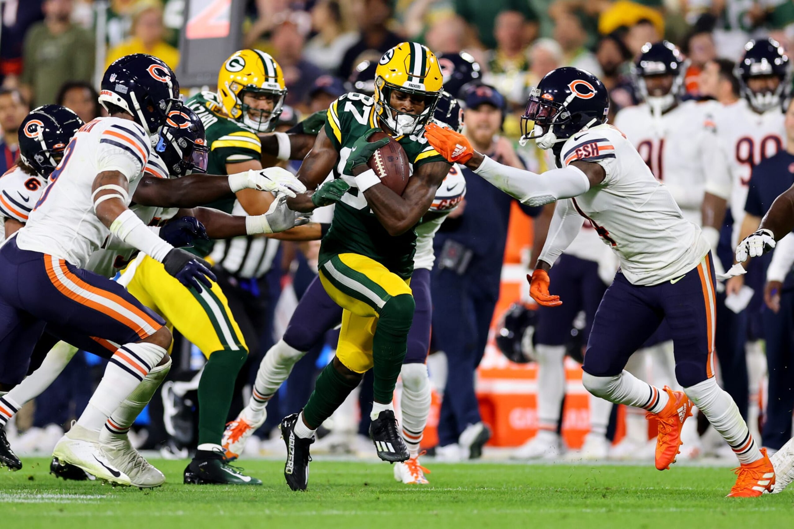 GREEN BAY, WISCONSIN - SEPTEMBER 18: Romeo Doubs #87 of the Green Bay Packers runs with the ball after a catch during the second quarter in the game against the Chicago Bears at Lambeau Field on September 18, 2022 in Green Bay, Wisconsin. (Photo by Michael Reaves/Getty Images)