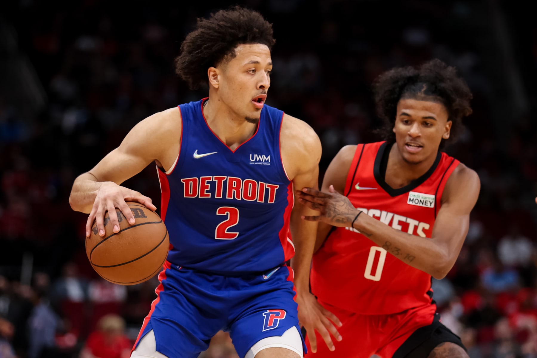 HOUSTON, TEXAS - NOVEMBER 10: Cade Cunningham #2 of the Detroit Pistons controls the ball ahead of Jalen Green #0 of the Houston Rockets during the second half at Toyota Center on November 10, 2021 in Houston, Texas. NOTE TO USER: User expressly acknowledges and agrees that, by downloading and or using this photograph, User is consenting to the terms and conditions of the Getty Images License Agreement. (Photo by Carmen Mandato/Getty Images)