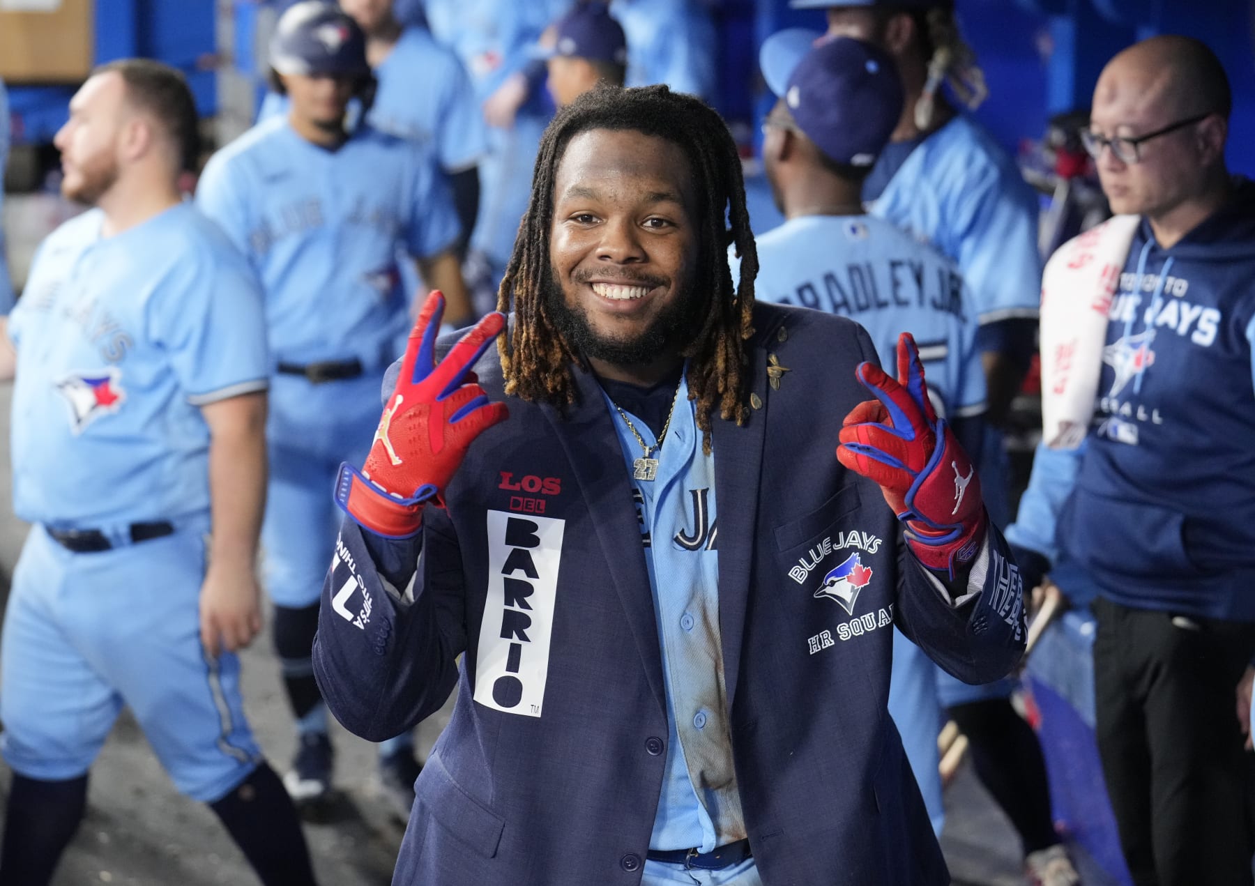 TORONTO, ON - SEPTEMBER 18: Vladimir Guerrero Jr. #27 of the Toronto Blue Jays celebrate this home run wearing The Blue Jacket against the Baltimore Orioles in the seventh inning during their MLB game at the Rogers Centre on September 18, 2022 in Toronto, Ontario, Canada. (Photo by Mark Blinch/Getty Images)