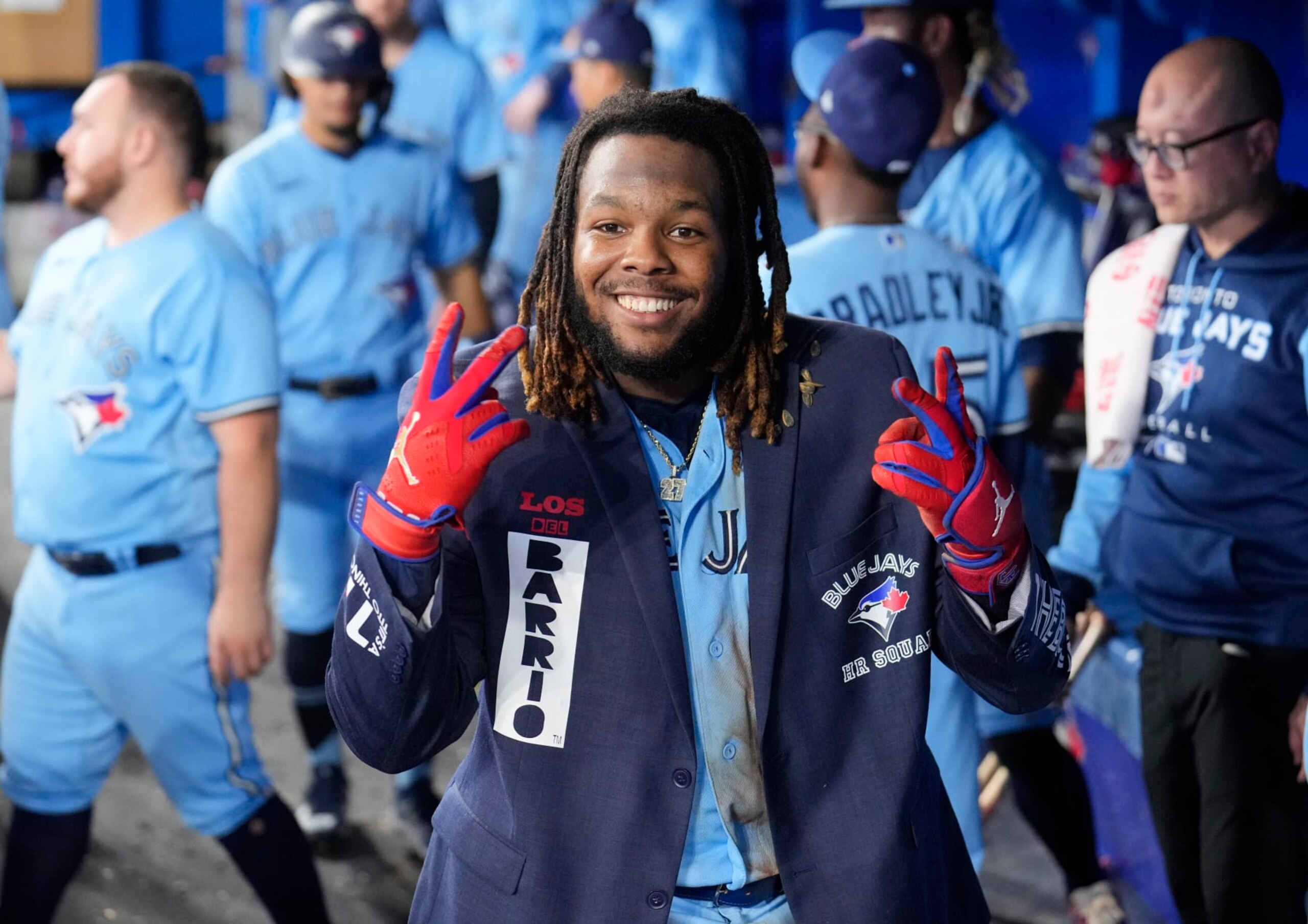 TORONTO, ON - SEPTEMBER 18: Vladimir Guerrero Jr. #27 of the Toronto Blue Jays celebrate this home run wearing The Blue Jacket against the Baltimore Orioles in the seventh inning during their MLB game at the Rogers Centre on September 18, 2022 in Toronto, Ontario, Canada. (Photo by Mark Blinch/Getty Images)