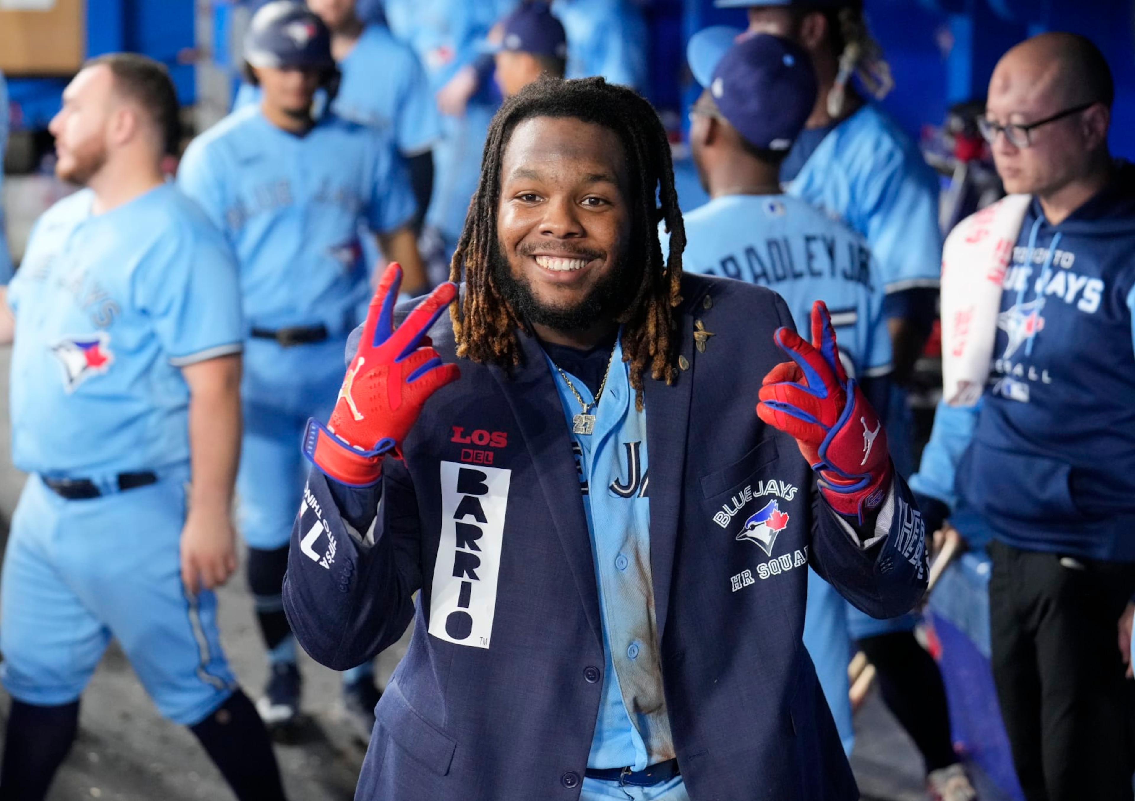 TORONTO, ON - SEPTEMBER 18: Vladimir Guerrero Jr. #27 of the Toronto Blue Jays celebrate this home run wearing The Blue Jacket against the Baltimore Orioles in the seventh inning during their MLB game at the Rogers Centre on September 18, 2022 in Toronto, Ontario, Canada. (Photo by Mark Blinch/Getty Images)