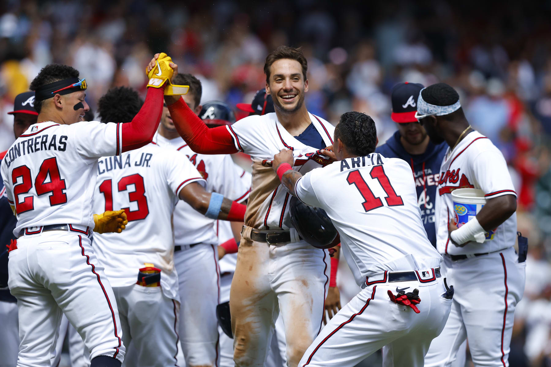 ATLANTA, GA - JULY 31: Matt Olson #28 reacts with teammates after scoring the winning run on Austin Riley's walk off double during the ninth inning against the Arizona Diamondbacks at Truist Park on July 31, 2022 in Atlanta, Georgia. (Photo by Todd Kirkland/Getty Images)