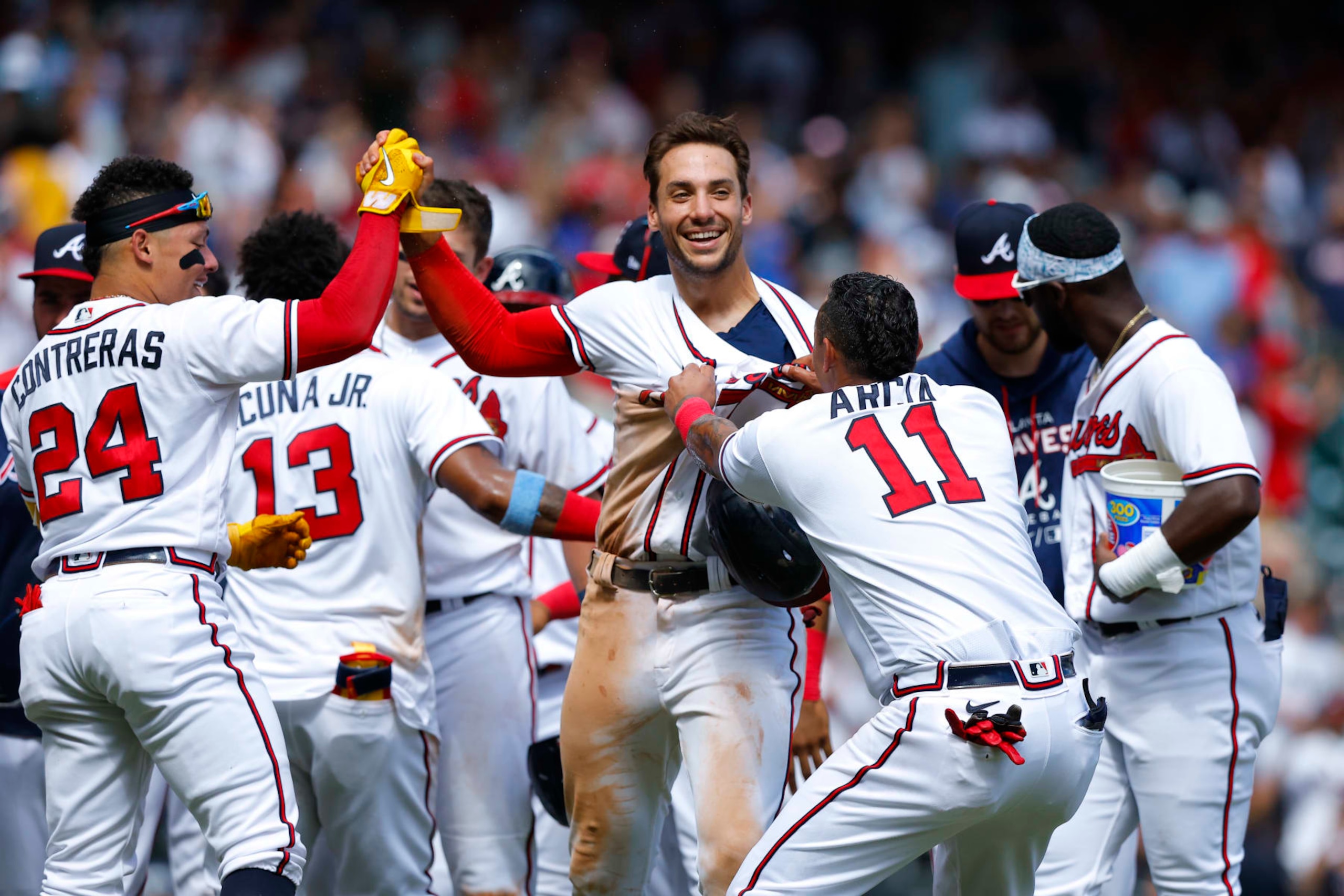 ATLANTA, GA - JULY 31: Matt Olson #28 reacts with teammates after scoring the winning run on Austin Riley's walk off double during the ninth inning against the Arizona Diamondbacks at Truist Park on July 31, 2022 in Atlanta, Georgia. (Photo by Todd Kirkland/Getty Images)