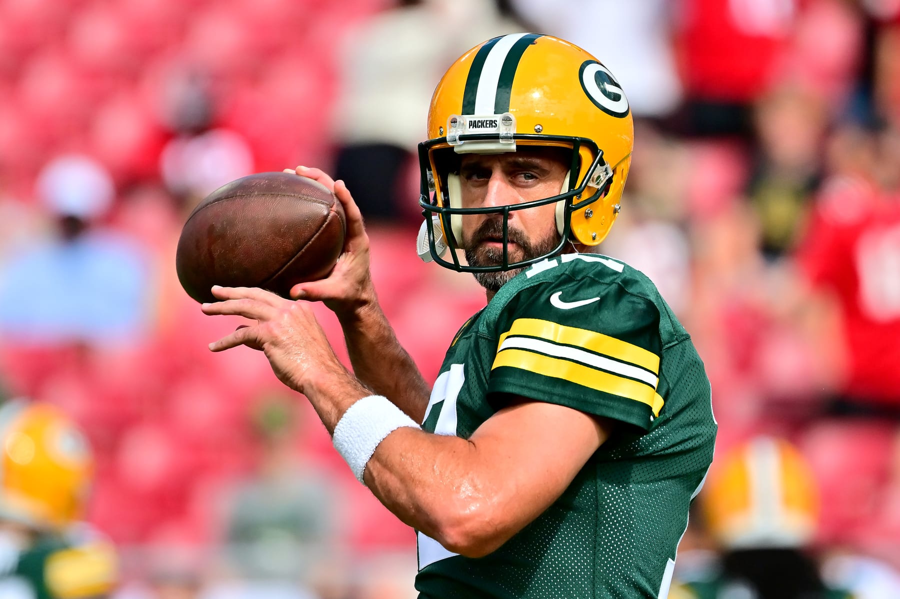 TAMPA, FLORIDA - SEPTEMBER 25: Aaron Rodgers #12 of the Green Bay Packers warms up prior to the game against the Tampa Bay Buccaneers at Raymond James Stadium on September 25, 2022 in Tampa, Florida. (Photo by Julio Aguilar/Getty Images)