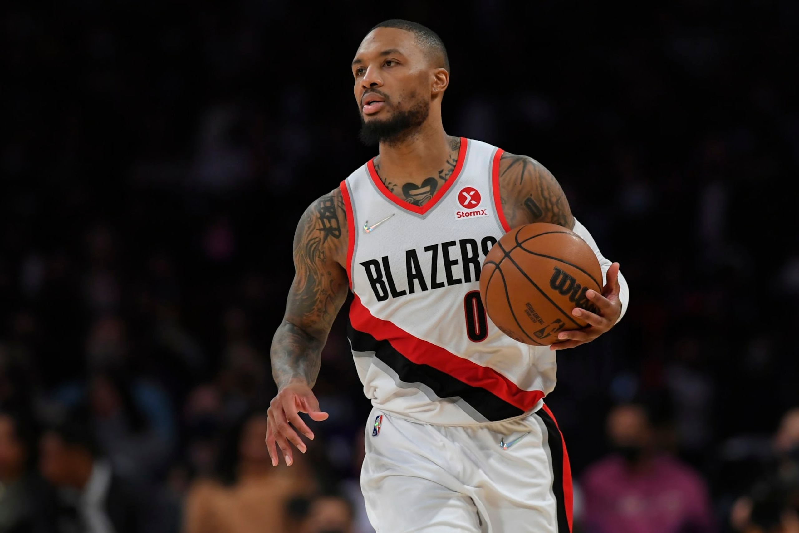 Portland Trail Blazers guard Damian Lillard (0) seen playing the Los Angeles Lakers in an NBA basketball game, Friday Dec. 31, 2021, in Los Angeles. (AP Photo/John McCoy) Portland Trail Blazers guard Damian Lillard (0) seen playing the Los Angeles Lakers in an NBA basketball game, Friday Dec. 31, 2021, in Los Angeles. (AP Photo/John McCoy)