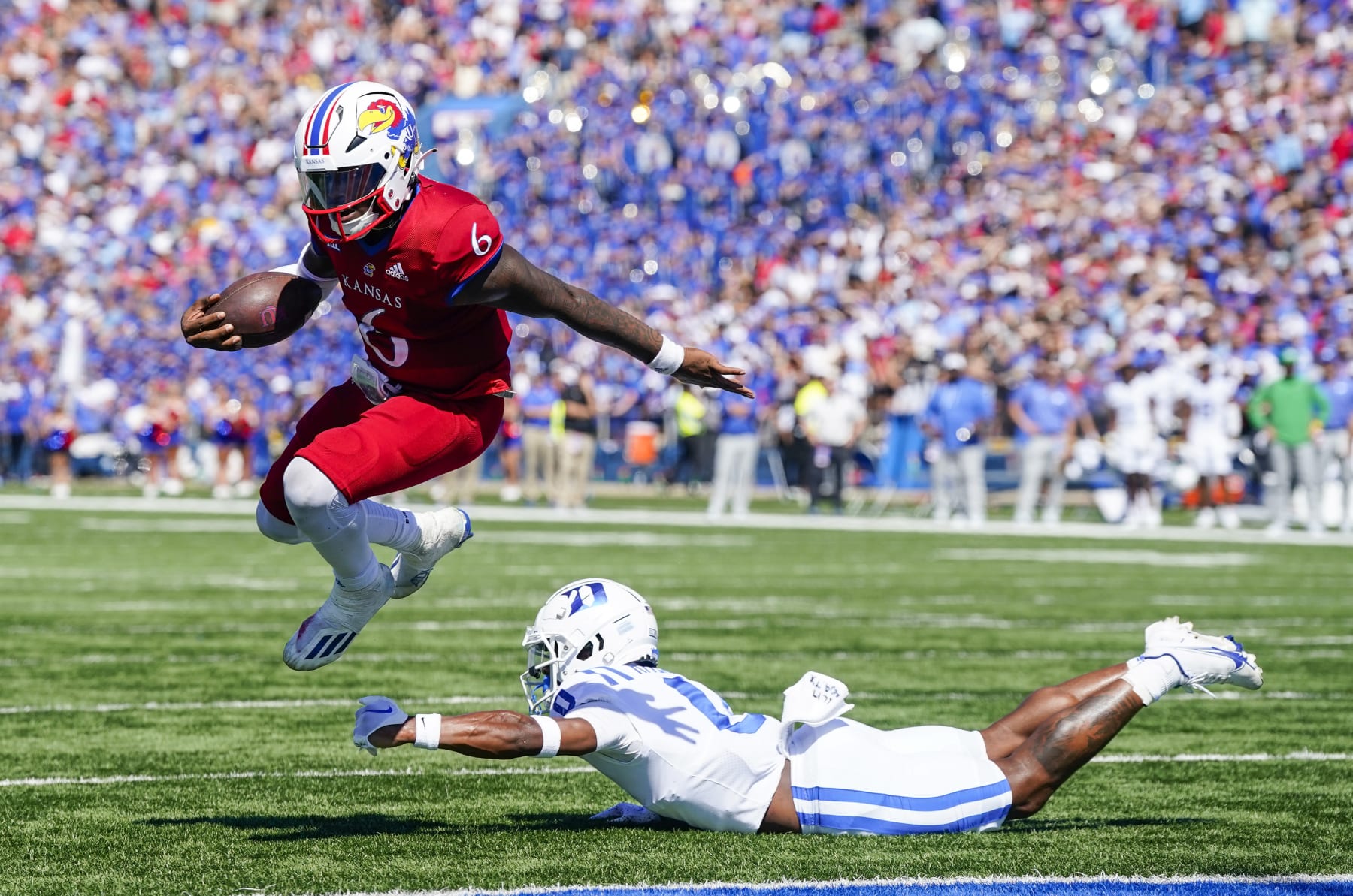 LAWRENCE, KS - SEPTEMBER 24: Jalon Daniels #6 of the Kansas Jayhawks runs for a touchdown past Chandler Rivers #0 of the Duke Blue Devils during the second half at David Booth Kansas Memorial Stadium on September 24, 2022 in Lawrence, Kansas. Kansas defeated Duke 35-27. (Photo by Jay Biggerstaff/Getty Images)