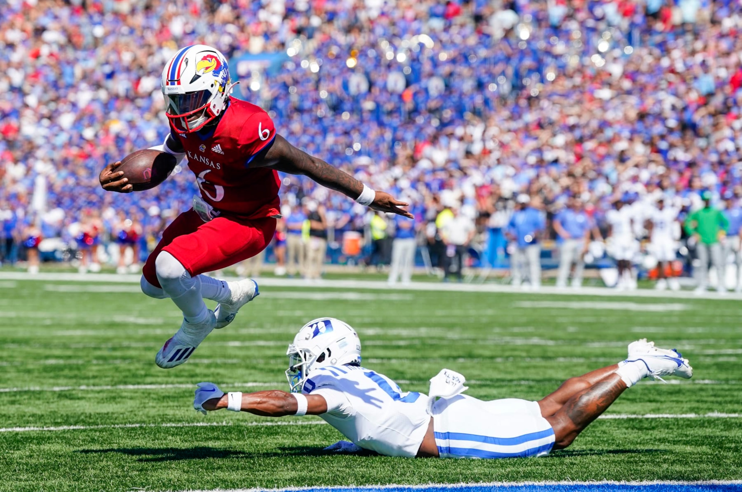 LAWRENCE, KS - SEPTEMBER 24: Jalon Daniels #6 of the Kansas Jayhawks runs for a touchdown past Chandler Rivers #0 of the Duke Blue Devils during the second half at David Booth Kansas Memorial Stadium on September 24, 2022 in Lawrence, Kansas. Kansas defeated Duke 35-27. (Photo by Jay Biggerstaff/Getty Images) LAWRENCE, KS - SEPTEMBER 24: Jalon Daniels #6 of the Kansas Jayhawks runs for a touchdown past Chandler Rivers #0 of the Duke Blue Devils during the second half at David Booth Kansas Memorial Stadium on September 24, 2022 in Lawrence, Kansas. Kansas defeated Duke 35-27. (Photo by Jay Biggerstaff/Getty Images)