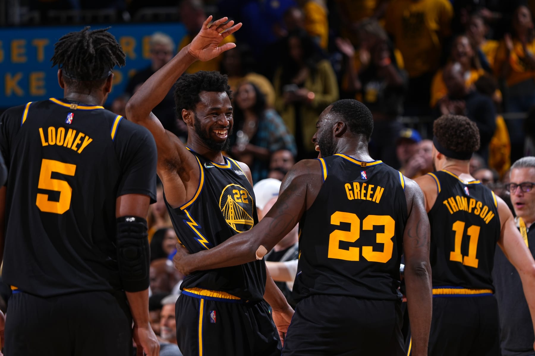 SAN FRANCISCO, CA - MAY 26: Andrew Wiggins #22 and Draymond Green #23 of the Golden State Warriors embrace during Game 5 of the 2022 NBA Playoffs Western Conference Finals on May 26, 2022 at Chase Center in San Francisco, California. NOTE TO USER: User expressly acknowledges and agrees that, by downloading and or using this photograph, user is consenting to the terms and conditions of Getty Images License Agreement. Mandatory Copyright Notice: Copyright 2022 NBAE (Photo by Garrett Ellwood/NBAE via Getty Images)