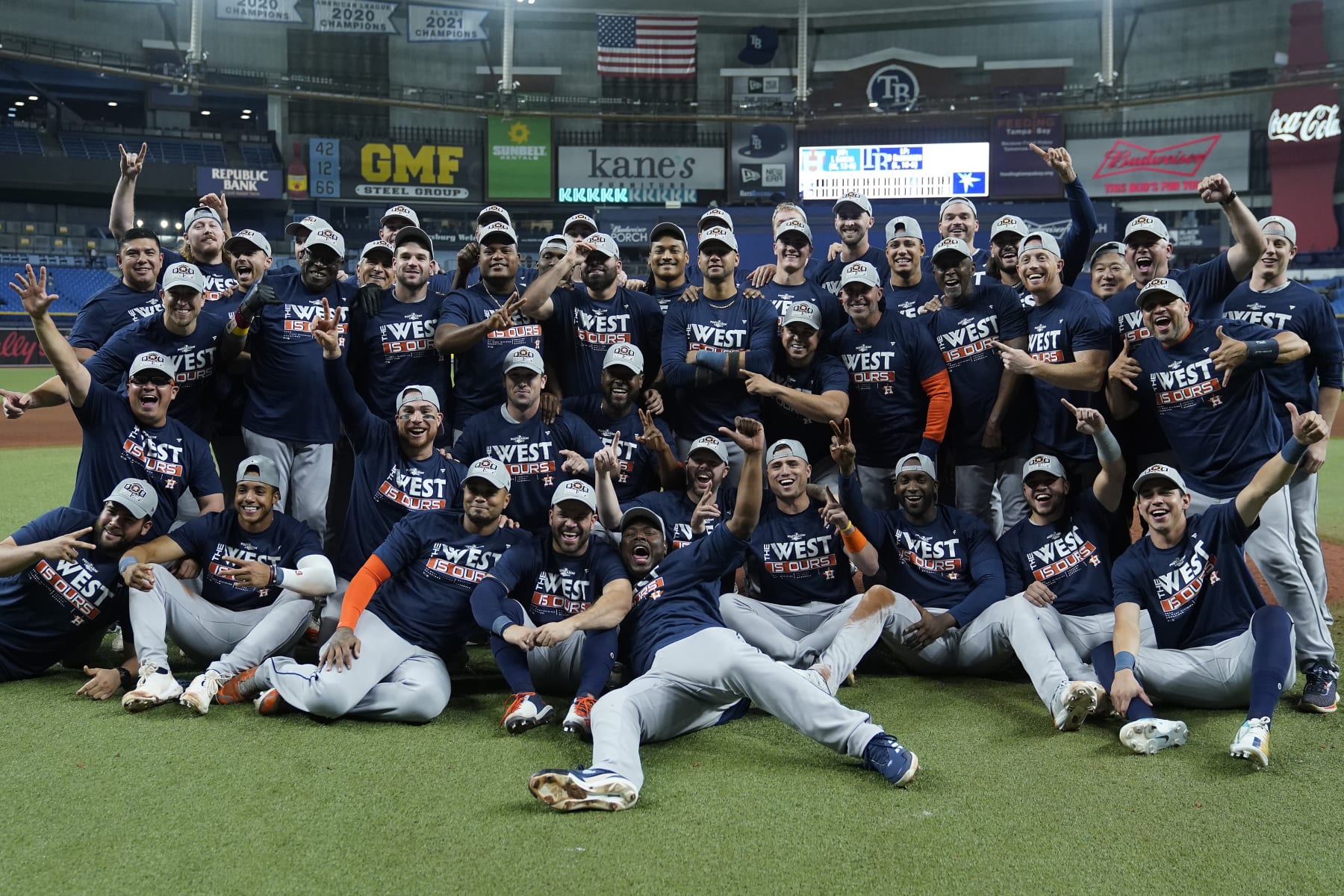 The Houston Astros pose for a photo after clinching the American League West title with a win over the Tampa Bay Rays during a baseball game Monday, Sept. 19, 2022, in St. Petersburg, Fla. (AP Photo/Chris O'Meara)