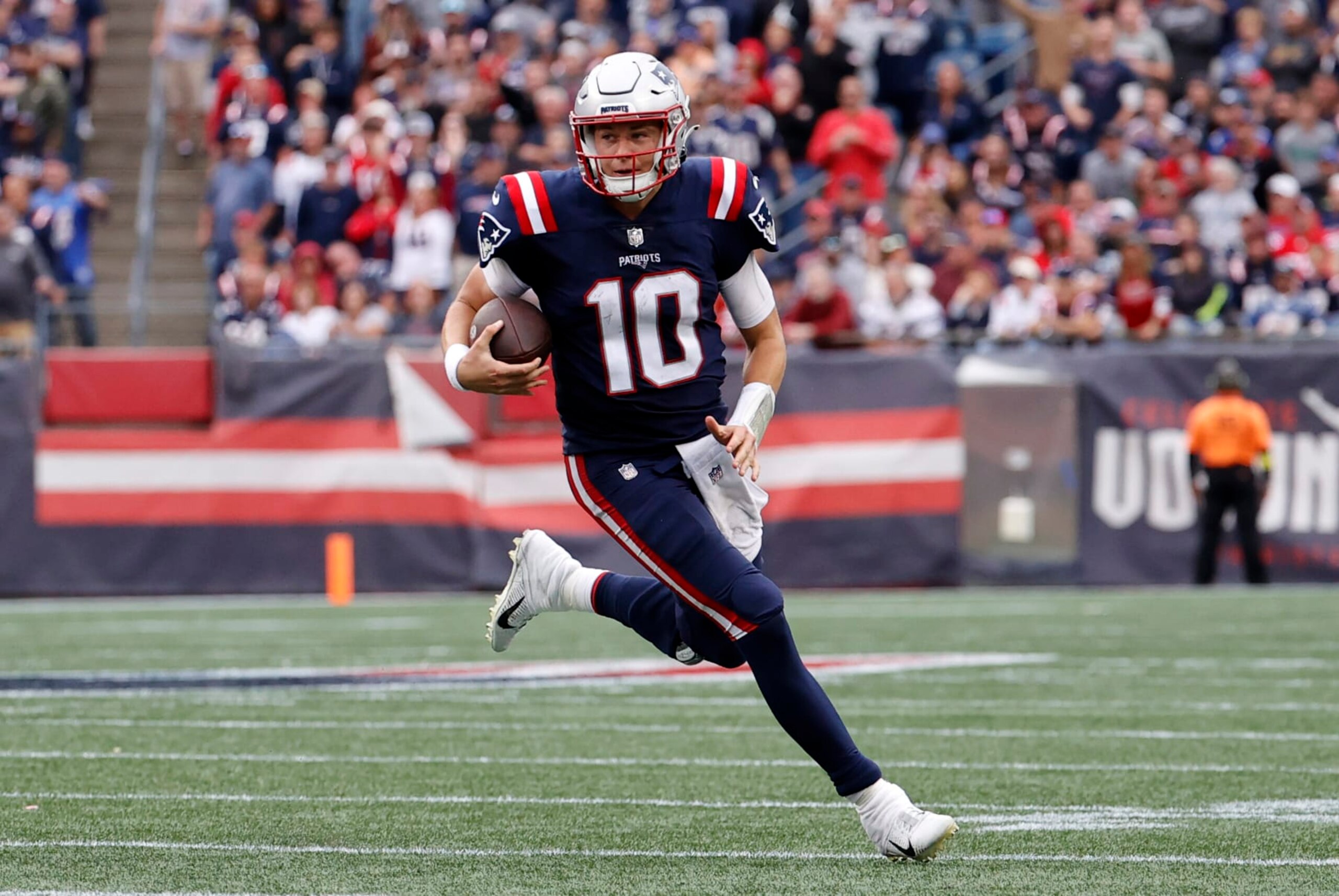 FOXBOROUGH, MA - SEPTEMBER 25: New England Patriots quarterback Mac Jones (10) rolls out during a game between the New England Patriots and the Baltimore Ravens on September 25, 2022, at Gillette Stadium in Foxborough, Massachusetts. (Photo by Fred Kfoury III/Icon Sportswire via Getty Images)