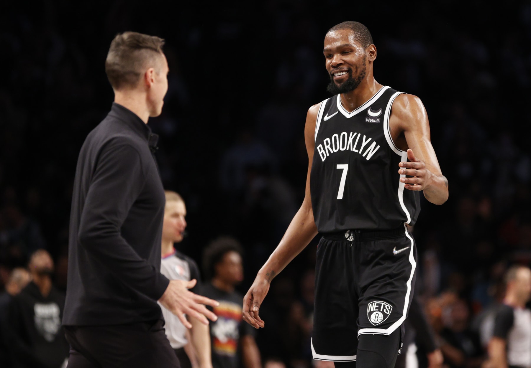 NEW YORK, NEW YORK - APRIL 12: Kevin Durant #7 of the Brooklyn Nets high-fives head coach Steve Nash during the second half of the Eastern Conference 2022 Play-In Tournament against the Cleveland Cavaliers at Barclays Center on April 12, 2022 in the Brooklyn borough of New York City. The Nets won 115-108. NOTE TO USER: User expressly acknowledges and agrees that, by downloading and or using this photograph, User is consenting to the terms and conditions of the Getty Images License Agreement. (Photo by Sarah Stier/Getty Images)