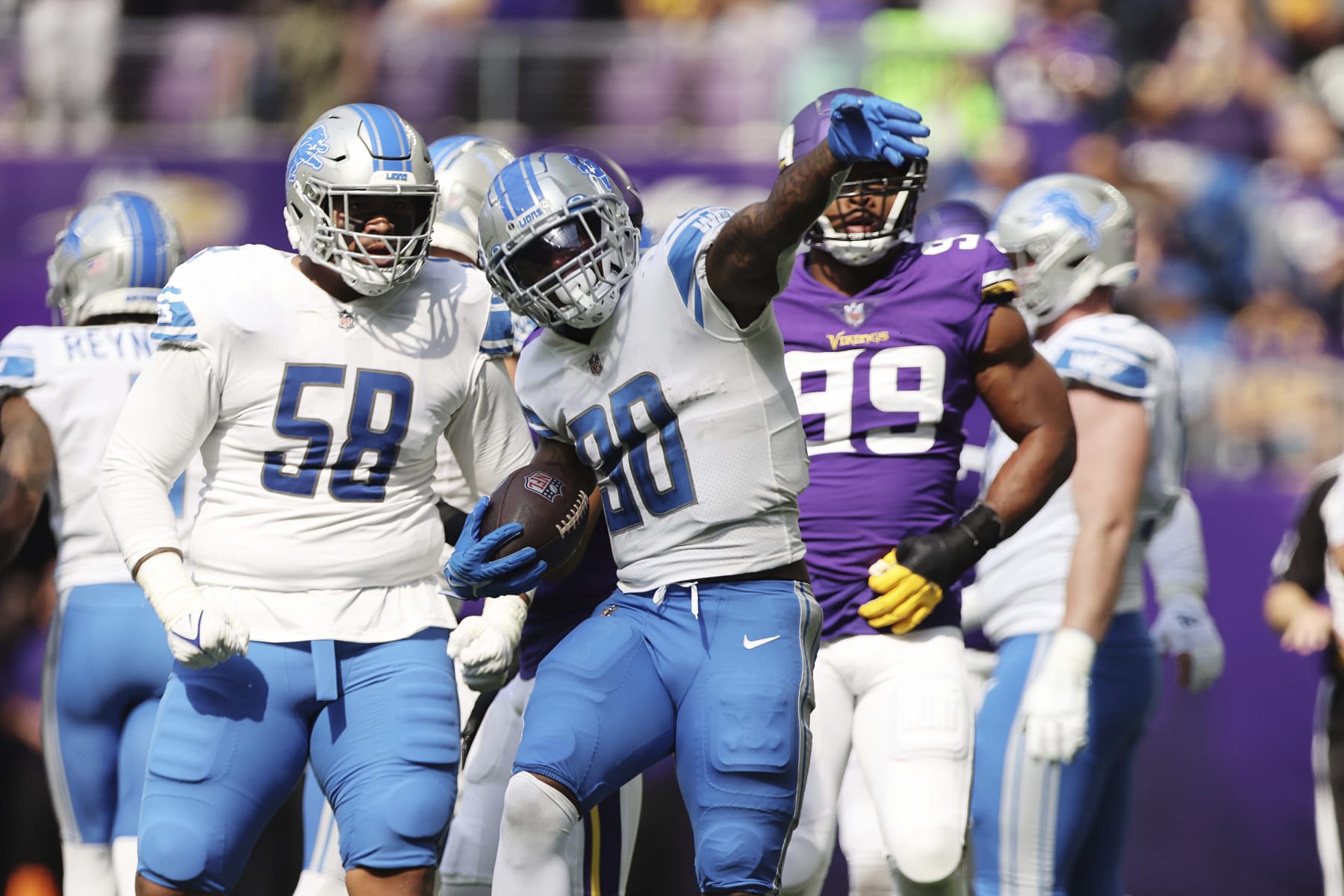 Detroit Lions running back Jamaal Williams (30) reacts after a play during the first half of an NFL football game against the Minnesota Vikings, Sunday, Sept. 25, 2022 in Minneapolis. (AP Photo/Stacy Bengs)