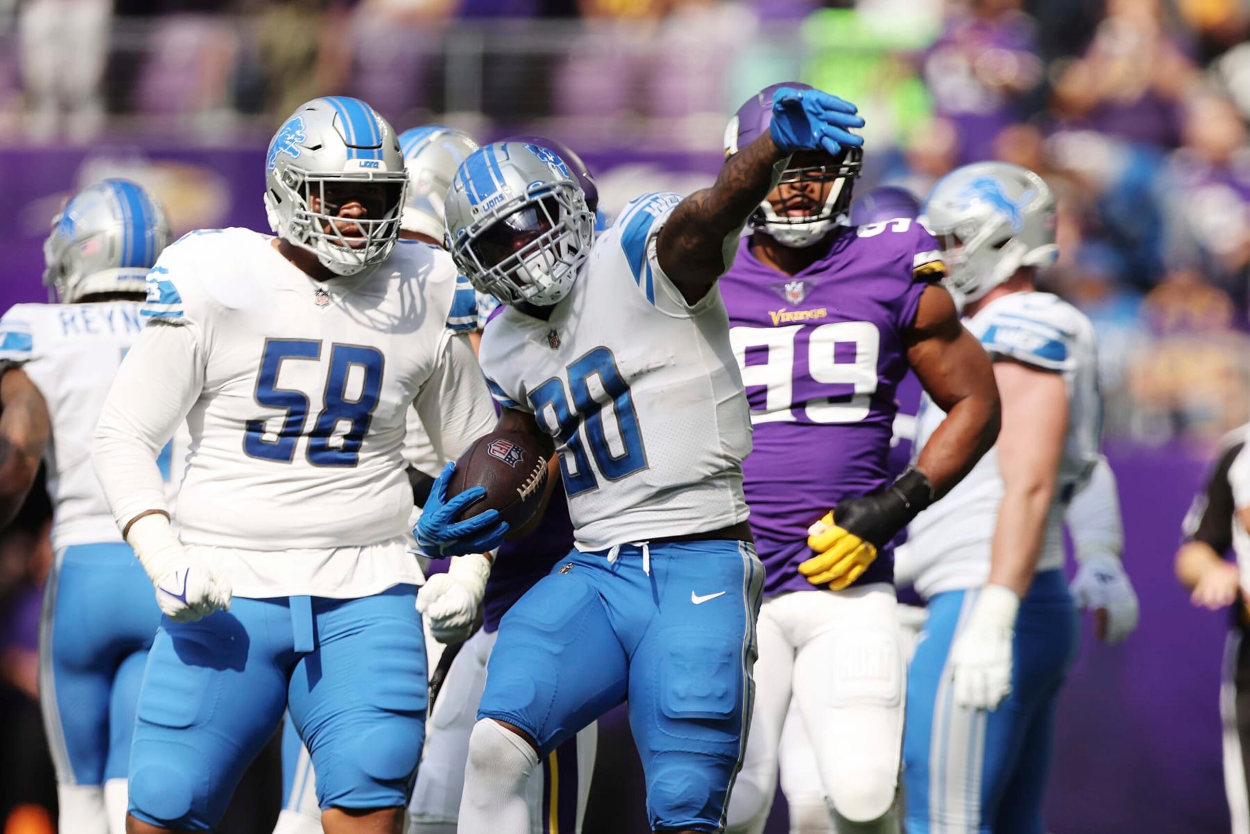 Detroit Lions running back Jamaal Williams (30) reacts after a play during the first half of an NFL football game against the Minnesota Vikings, Sunday, Sept. 25, 2022 in Minneapolis. (AP Photo/Stacy Bengs)