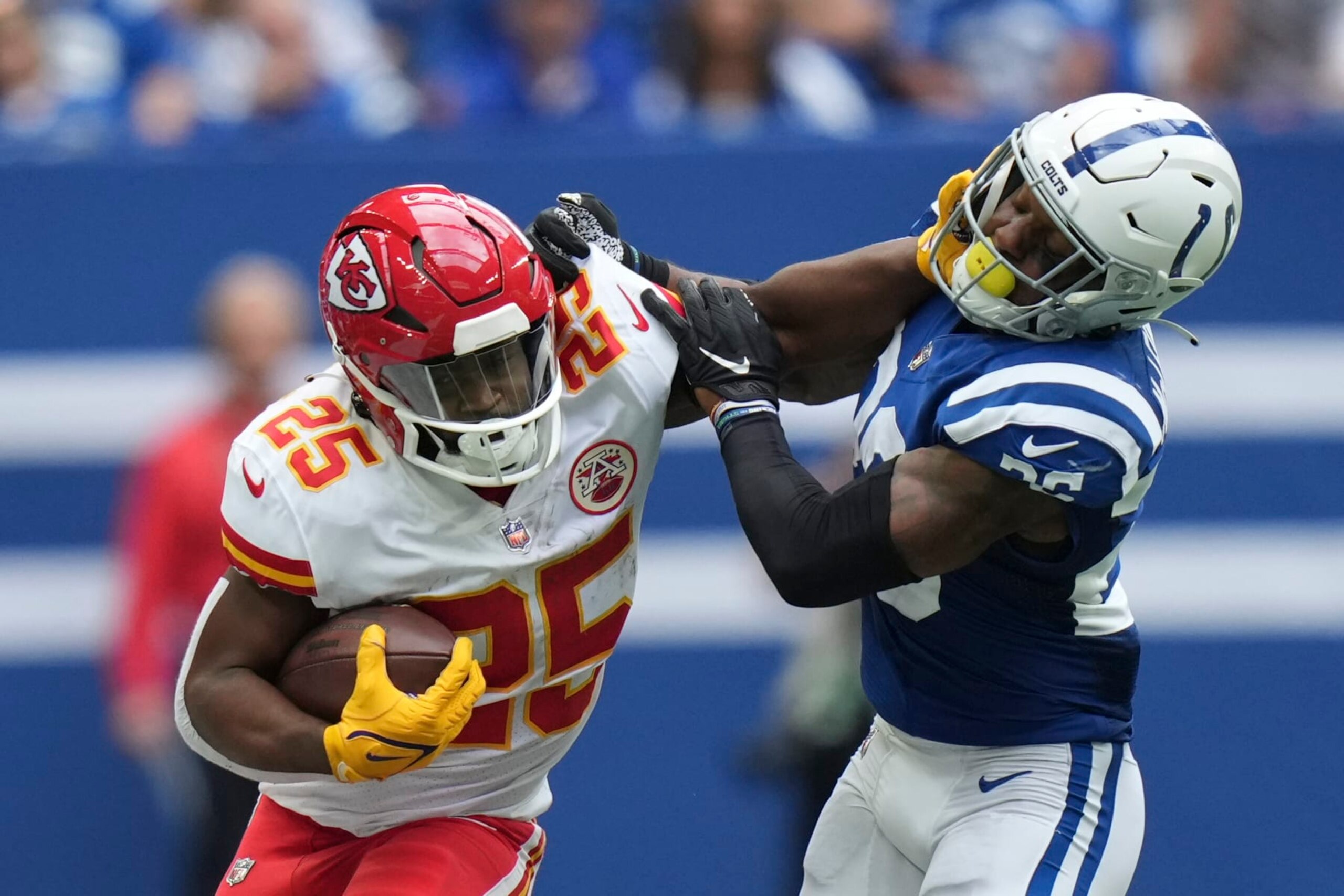 Kansas City Chiefs running back Clyde Edwards-Helaire (25) is tackled by Indianapolis Colts' Rodney McLeod (26) during the second half of an NFL football game, Sunday, Sept. 25, 2022, in Indianapolis. (AP Photo/AJ Mast)