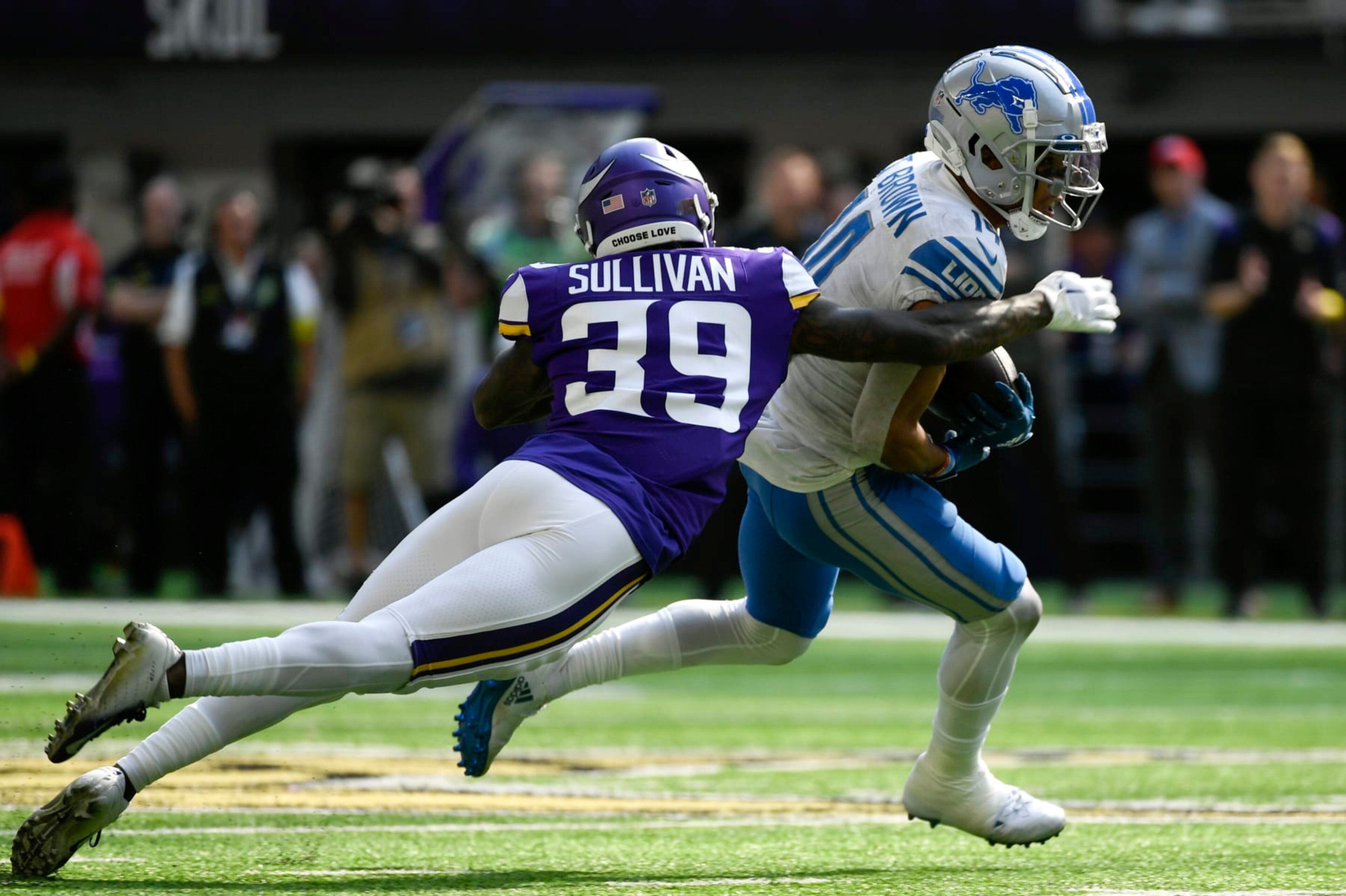Detroit Lions wide receiver Amon-Ra St. Brown (14) runs from Minnesota Vikings cornerback Chandon Sullivan (39) after catching a pass during the second half of an NFL football game, Sunday, Sept. 25, 2022, in Minneapolis. (AP Photo/Craig Lassig) Detroit Lions wide receiver Amon-Ra St. Brown (14) runs from Minnesota Vikings cornerback Chandon Sullivan (39) after catching a pass during the second half of an NFL football game, Sunday, Sept. 25, 2022, in Minneapolis. (AP Photo/Craig Lassig)