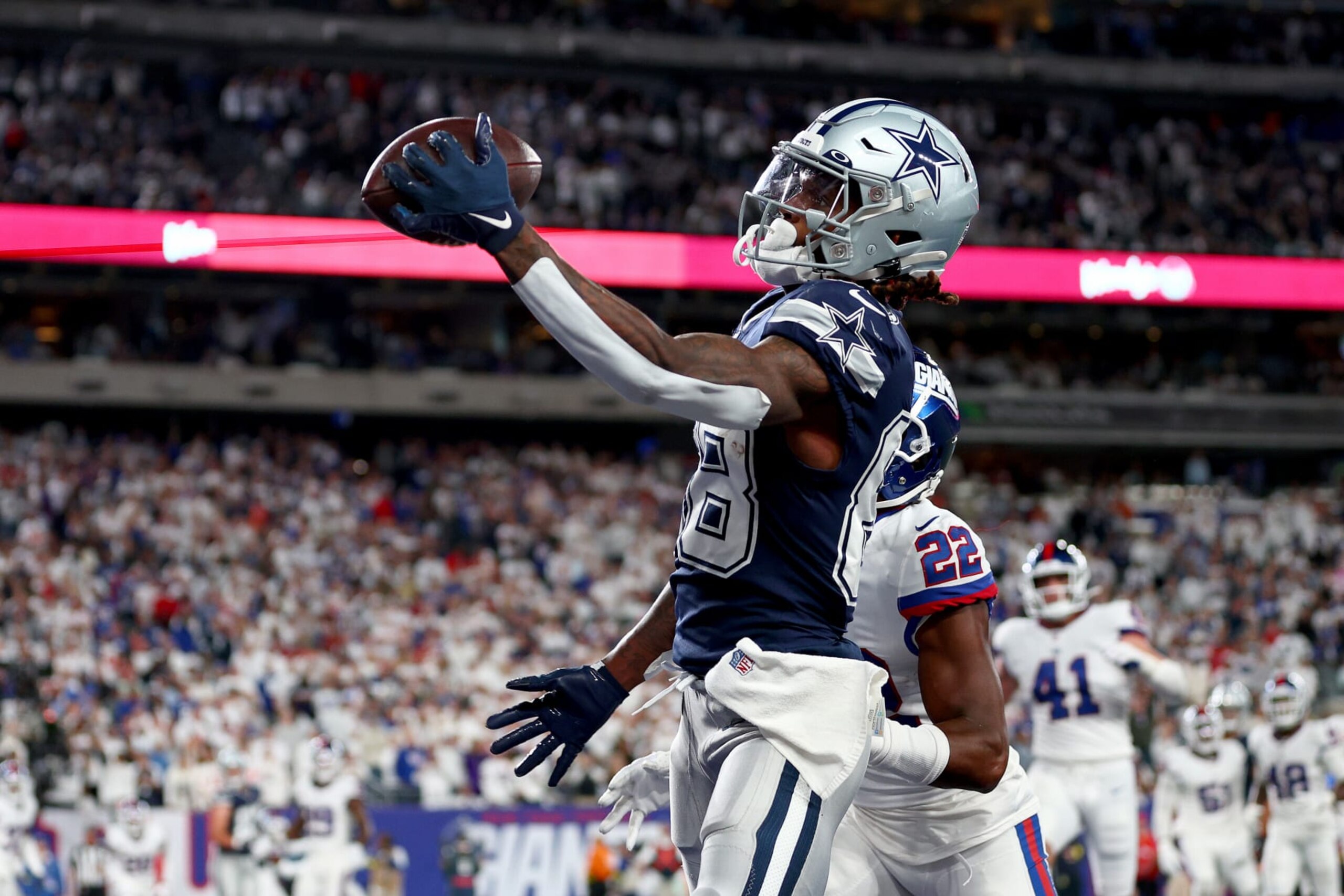 EAST RUTHERFORD, NEW JERSEY - SEPTEMBER 26: CeeDee Lamb #88 of the Dallas Cowboys catches a 1 yard touchdown pass against the New York Giants during the fourth quarter in the game at MetLife Stadium on September 26, 2022 in East Rutherford, New Jersey. (Photo by Elsa/Getty Images)