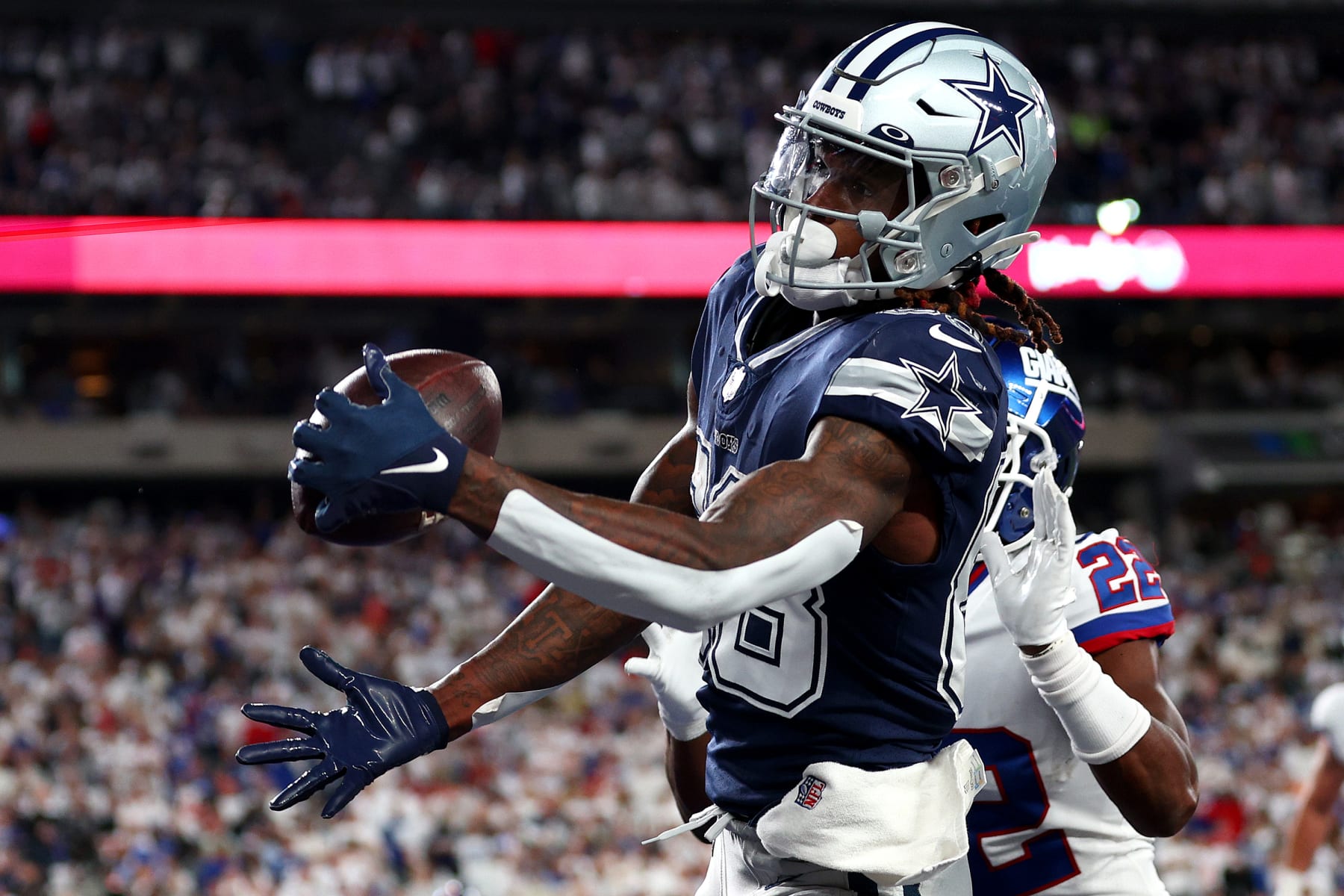 EAST RUTHERFORD, NEW JERSEY - SEPTEMBER 26: CeeDee Lamb #88 of the Dallas Cowboys catches a 1 yard touchdown pass against the New York Giants during the fourth quarter in the game at MetLife Stadium on September 26, 2022 in East Rutherford, New Jersey. (Photo by Elsa/Getty Images)