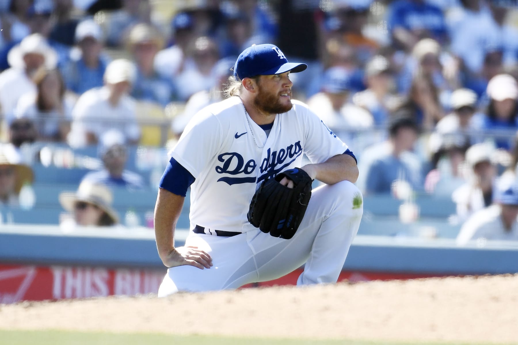 LOS ANGELES, CA - JULY 03: Closer Craig Kimbrel #46 of the Los Angeles Dodgers reacts after getting hit in the lower back by a ball off the bat of Jake Cronenworth #9 of the San Diego Padres during the ninth inning at Dodger Stadium on July 3, 2022 in Los Angeles, California. Kimbrel was replaced after blowing a save following his injury. Padres win, 4-2. (Photo by Kevork Djansezian/Getty Images)