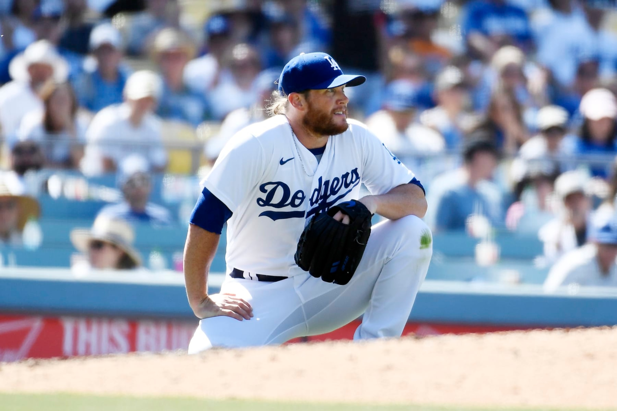 LOS ANGELES, CA - JULY 03: Closer Craig Kimbrel #46 of the Los Angeles Dodgers reacts after getting hit in the lower back by a ball off the bat of Jake Cronenworth #9 of the San Diego Padres during the ninth inning at Dodger Stadium on July 3, 2022 in Los Angeles, California. Kimbrel was replaced after blowing a save following his injury. Padres win, 4-2. (Photo by Kevork Djansezian/Getty Images)