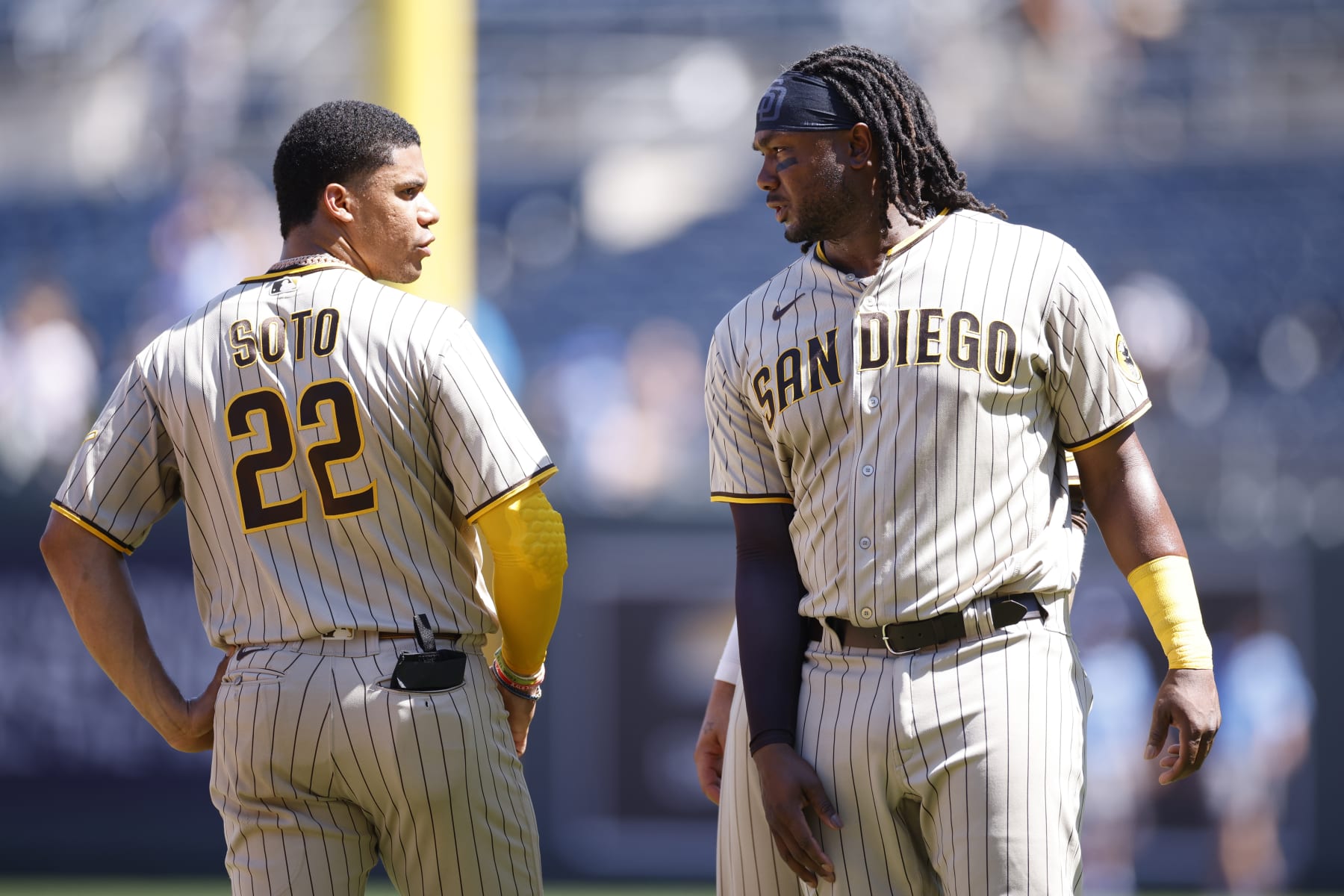 KANSAS CITY, MO - AUGUST 28: San Diego Padres first baseman Josh Bell (24) talks to right fielder Juan Soto (22) during an MLB game against the Kansas City Royals on August 28, 2022 at Kauffman Stadium in Kansas City, Missouri. (Photo by Joe Robbins/Icon Sportswire via Getty Images)