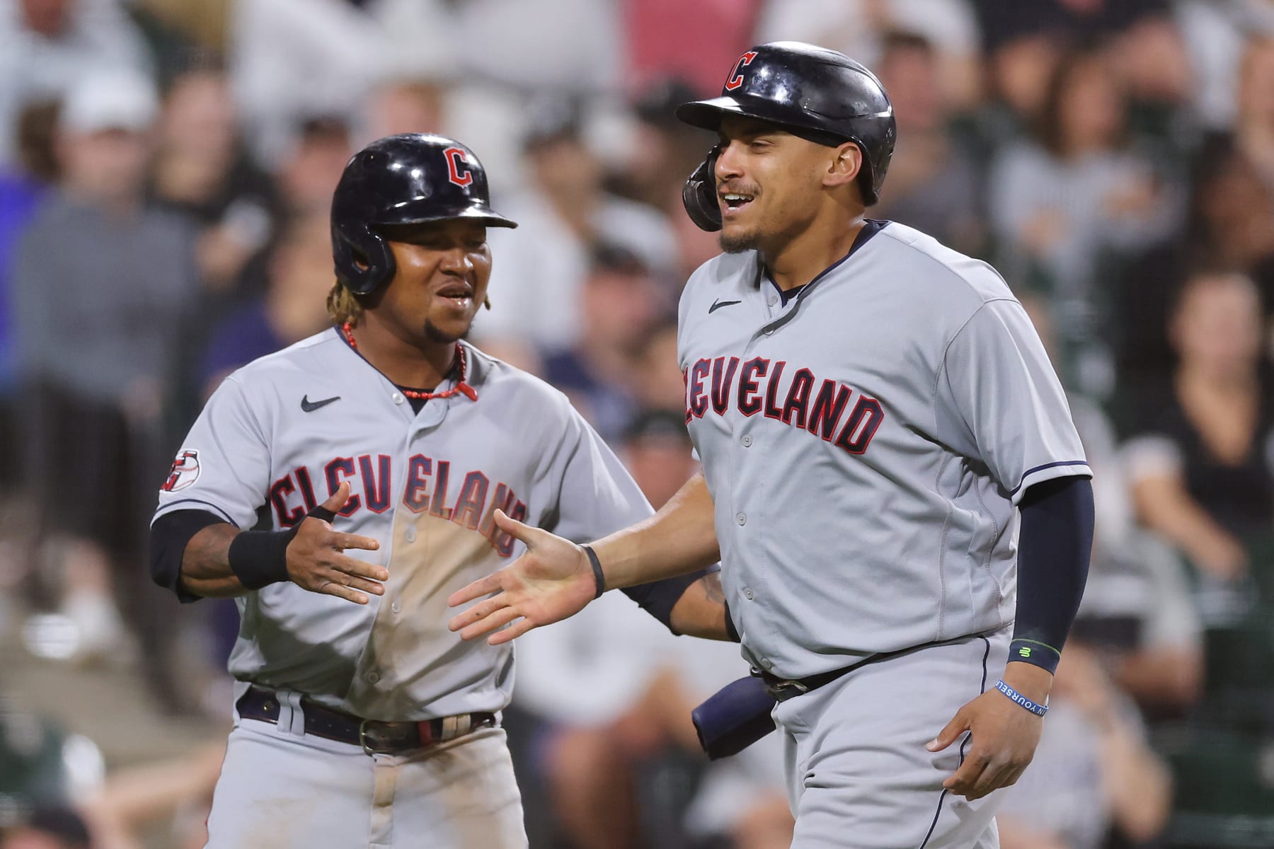 CHICAGO, ILLINOIS - SEPTEMBER 21: Josh Naylor #22 of the Cleveland Guardians celebrates his two-run home run with Jose Ramirez #11 against the Chicago White Sox during the seventh inning at Guaranteed Rate Field on September 21, 2022 in Chicago, Illinois. (Photo by Michael Reaves/Getty Images)
