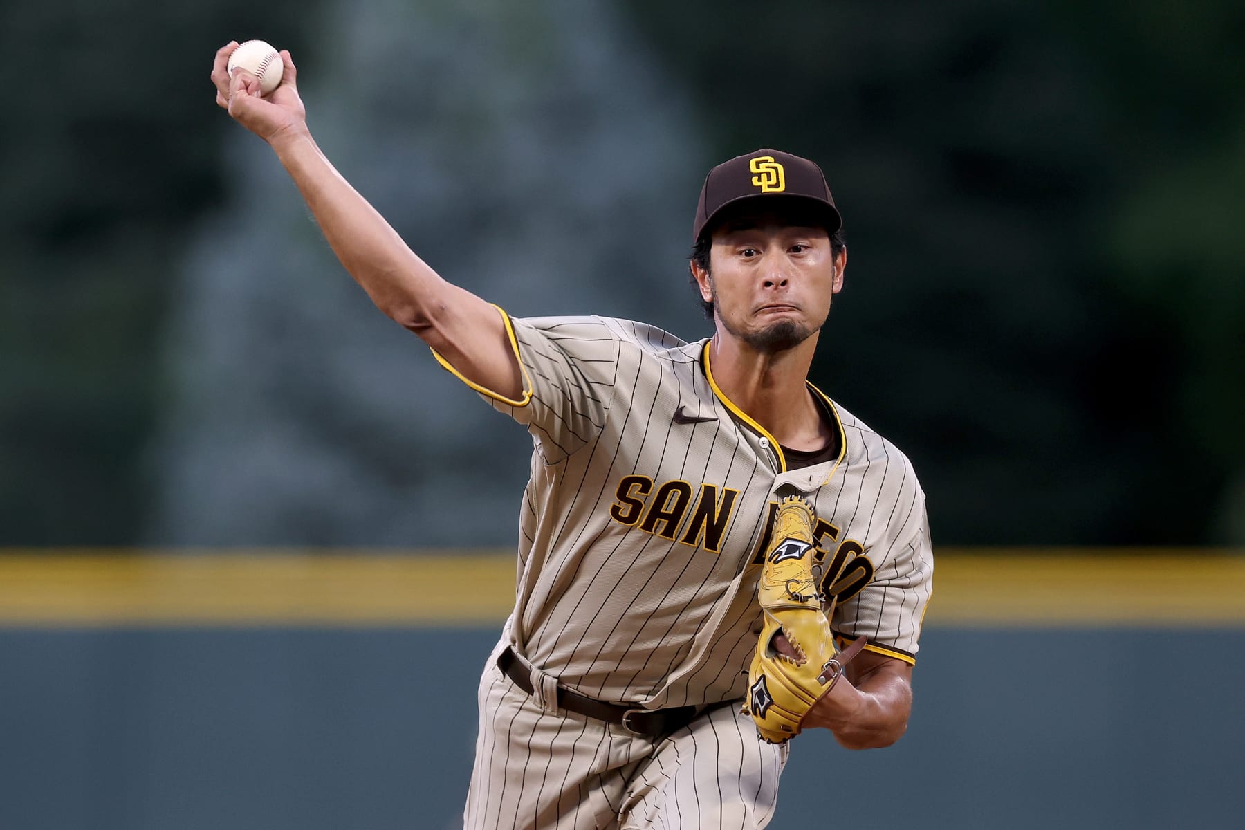 DENVER, COLORADO - SEPTEMBER 24: Starting pitcher Yu Darvish #11 of the San Diego Padres throws against the Colorado Rockies in the first inning at Coors Field on September 24, 2022 in Denver, Colorado. (Photo by Matthew Stockman/Getty Images)