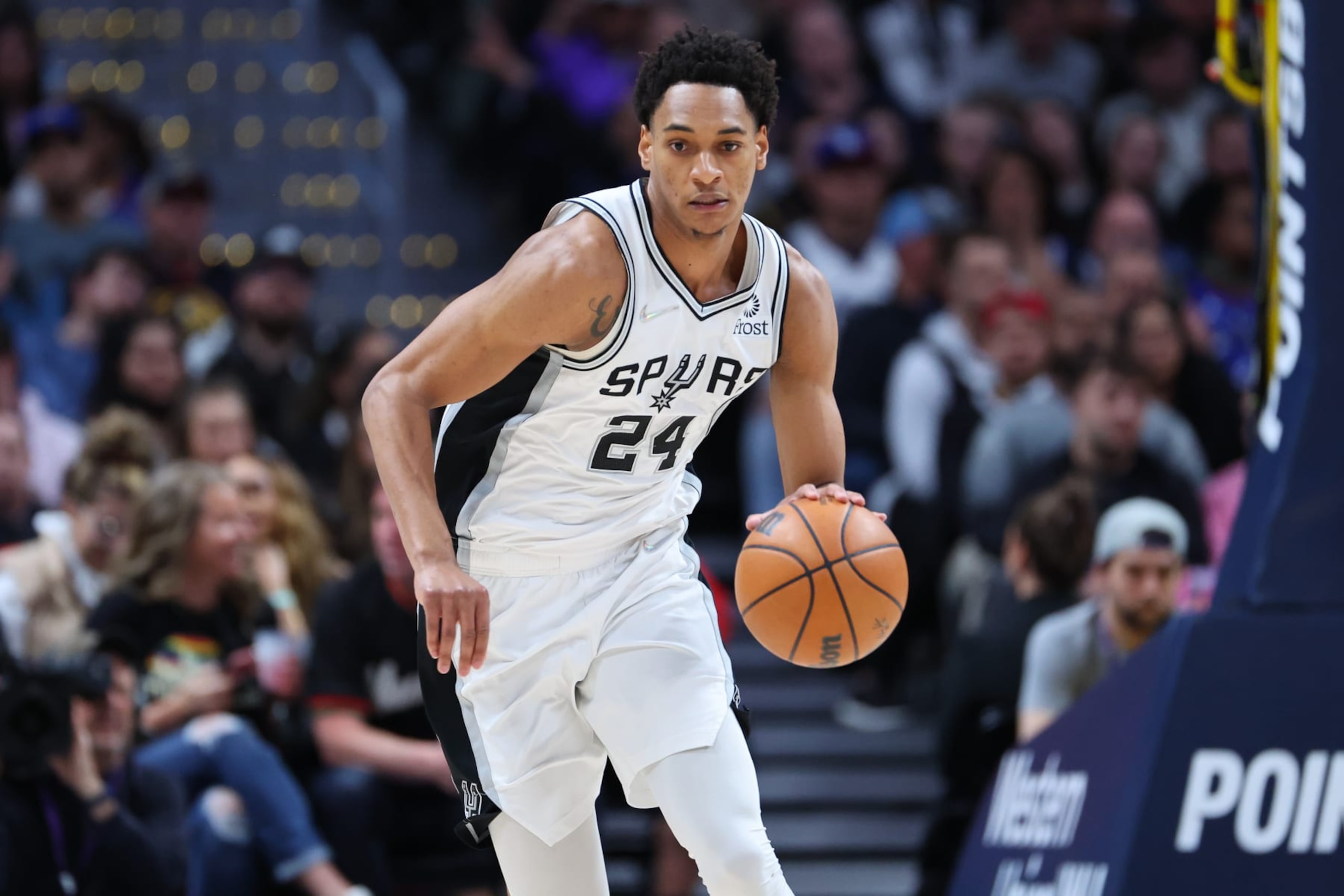 DENVER, CO - APRIL 05: Devin Vassell #24 of the San Antonio Spurs handles the ball against the Denver Nuggets during the second quarter at Ball Arena on April 5, 2022 in Denver, Colorado.  NOTE TO USER: User expressly acknowledges and agrees that, by downloading and or using this photograph, User is consenting to the terms and conditions of the Getty Images License Agreement. (Photo by C. Morgan Engel/Getty Images)