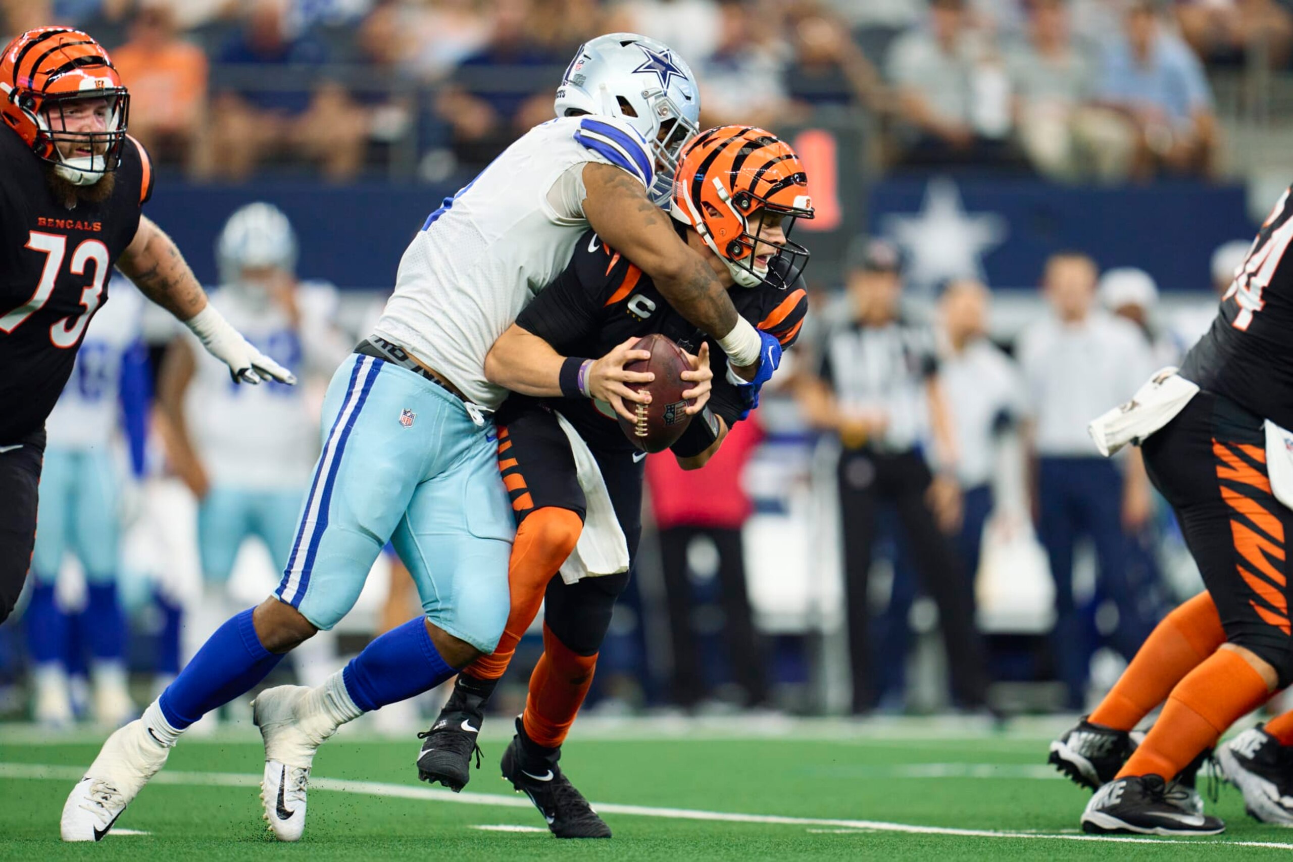 ARLINGTON, TX - SEPTEMBER 18: Micah Parsons #11 of the Dallas Cowboys sacks Joe Burrow #9 of the Cincinnati Bengals at AT&T Stadium on September 18, 2022 in Arlington, Texas. (Photo by Cooper Neill/Getty Images) ARLINGTON, TX - SEPTEMBER 18: Micah Parsons #11 of the Dallas Cowboys sacks Joe Burrow #9 of the Cincinnati Bengals at AT&T Stadium on September 18, 2022 in Arlington, Texas. (Photo by Cooper Neill/Getty Images)