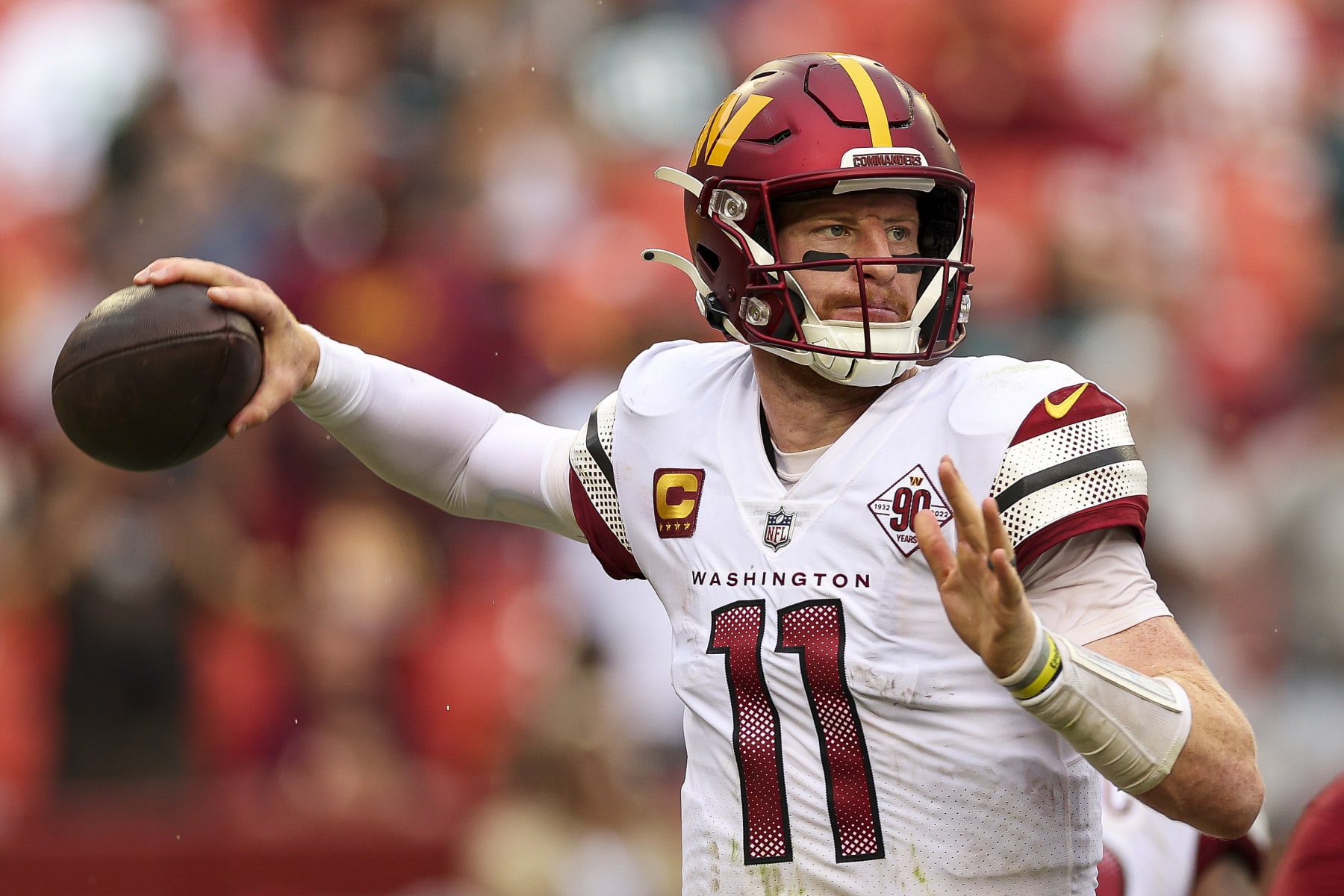 LANDOVER, MARYLAND - SEPTEMBER 25: Quarterback Carson Wentz #11 of the Washington Commanders attempts a pass during the second half against the Philadelphia Eagles at FedExField on September 25, 2022 in Landover, Maryland. (Photo by Patrick Smith/Getty Images)