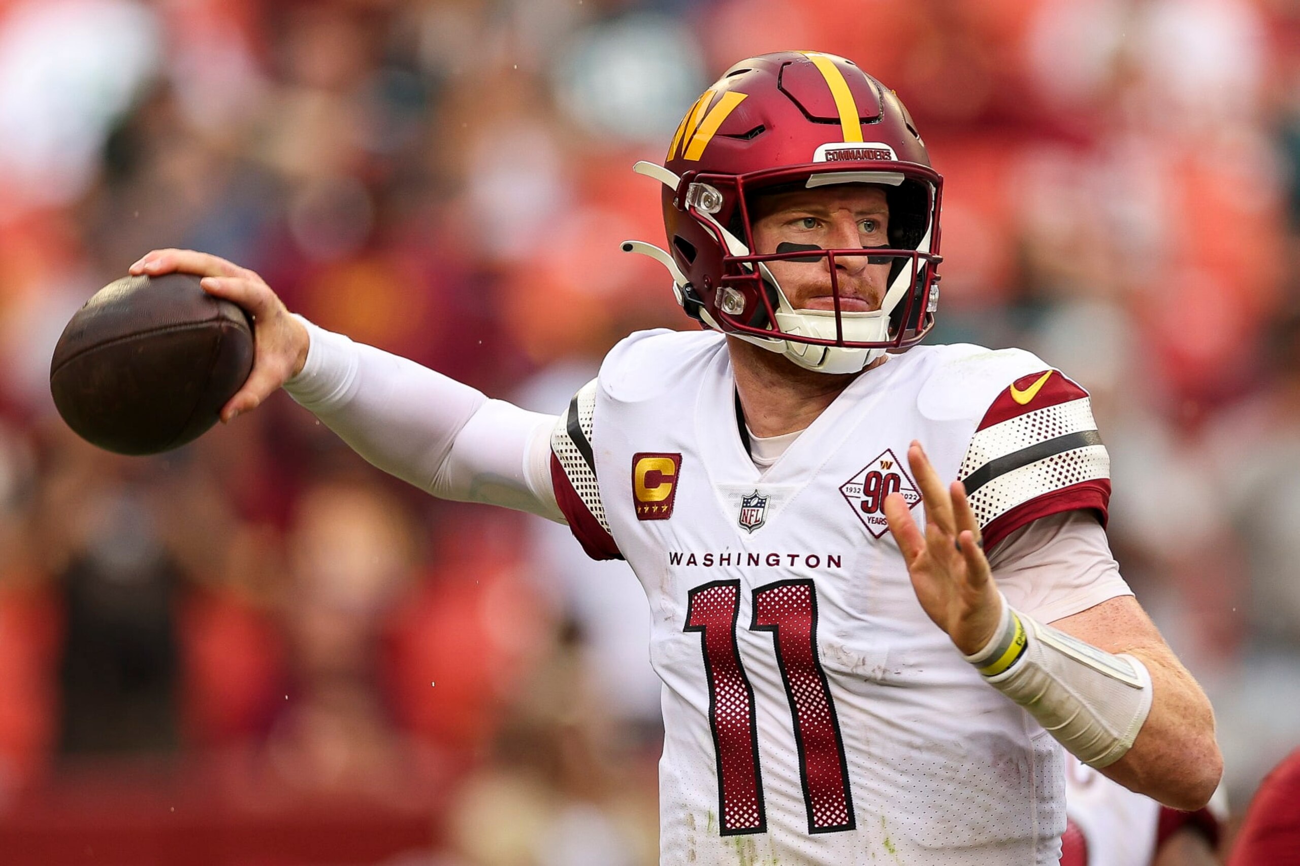 LANDOVER, MARYLAND - SEPTEMBER 25: Quarterback Carson Wentz #11 of the Washington Commanders attempts a pass during the second half against the Philadelphia Eagles at FedExField on September 25, 2022 in Landover, Maryland. (Photo by Patrick Smith/Getty Images)