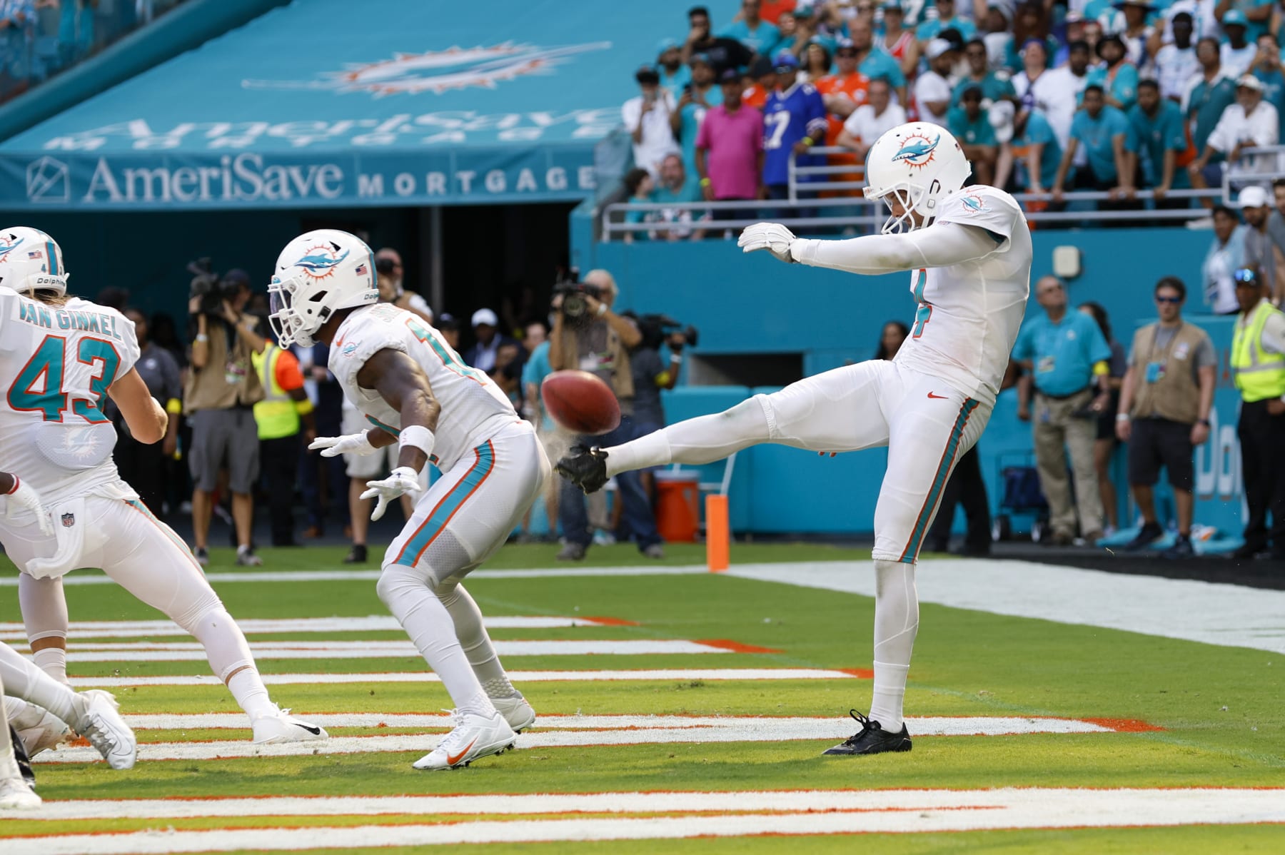 MIAMI GARDENS, FL - SEPTEMBER 25: Miami Dolphins punter Thomas Morstead (4) punts the ball off the backside of Miami Dolphins wide receiver Trent Sherfield (14) for a safety during the game between the Buffalo Bills and the Miami Dolphins on September 25, 2022 at Hard Rock Stadium in Miami Gardens, Fl. (Photo by David Rosenblum/Icon Sportswire via Getty Images)