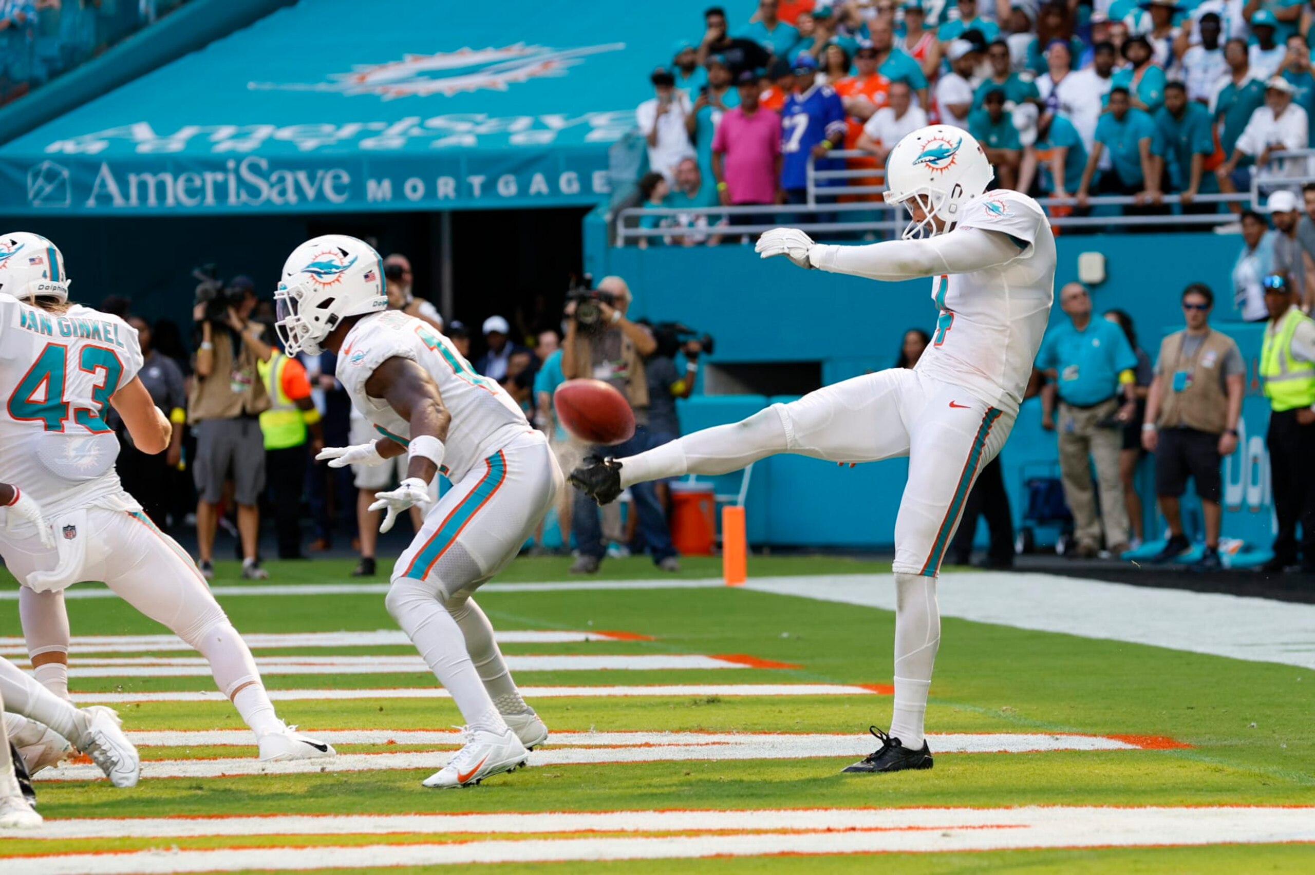MIAMI GARDENS, FL - SEPTEMBER 25: Miami Dolphins punter Thomas Morstead (4) punts the ball off the backside of Miami Dolphins wide receiver Trent Sherfield (14) for a safety during the game between the Buffalo Bills and the Miami Dolphins on September 25, 2022 at Hard Rock Stadium in Miami Gardens, Fl. (Photo by David Rosenblum/Icon Sportswire via Getty Images)