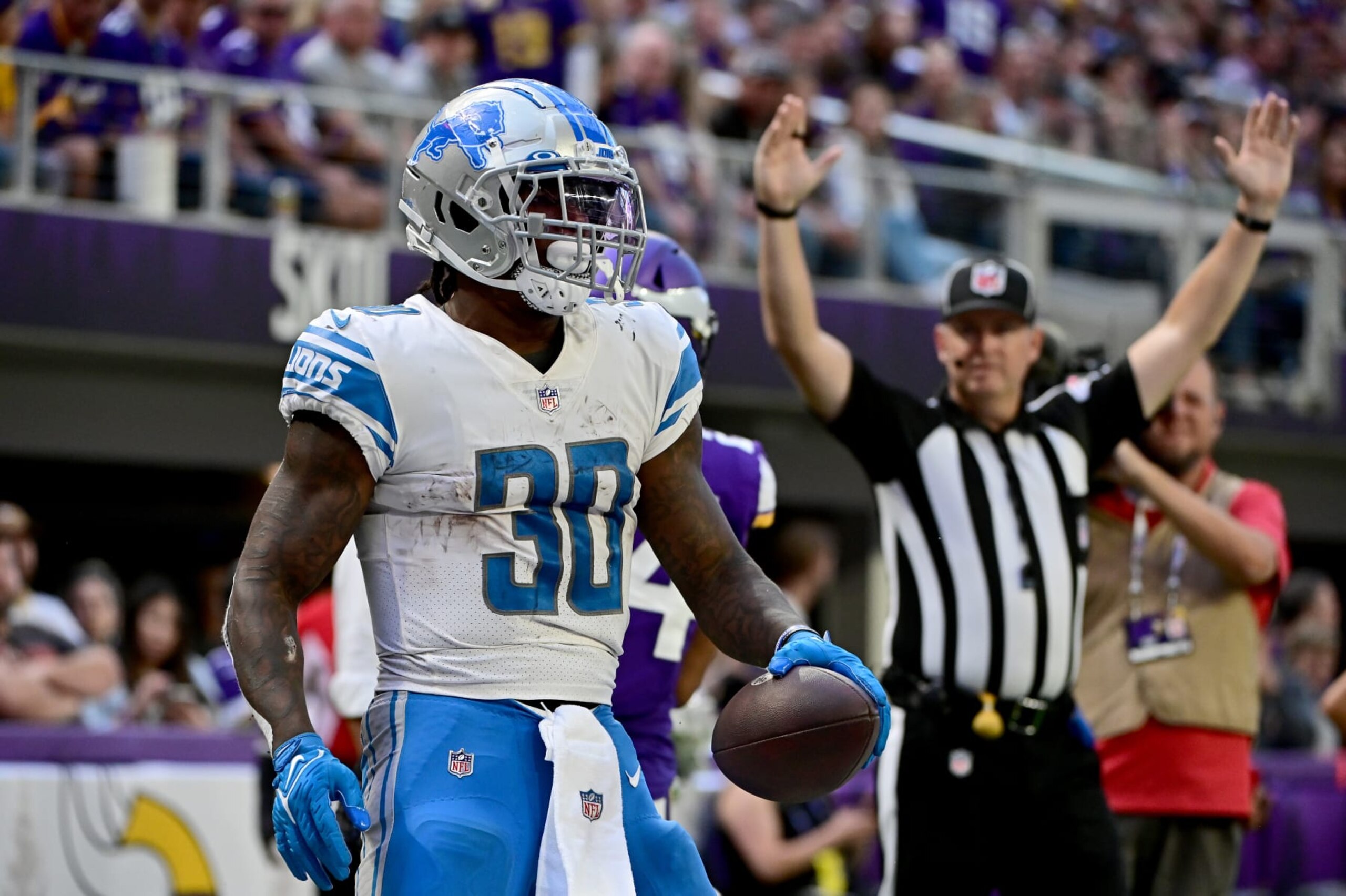 MINNEAPOLIS, MINNESOTA - SEPTEMBER 25: Running back Jamaal Williams #30 of the Detroit Lions celebrates after scoring a touchdown in the third quarter of the game against the Minnesota Vikingsat U.S. Bank Stadium on September 25, 2022 in Minneapolis, Minnesota.  (Photo by Stephen Maturen/Getty Images)