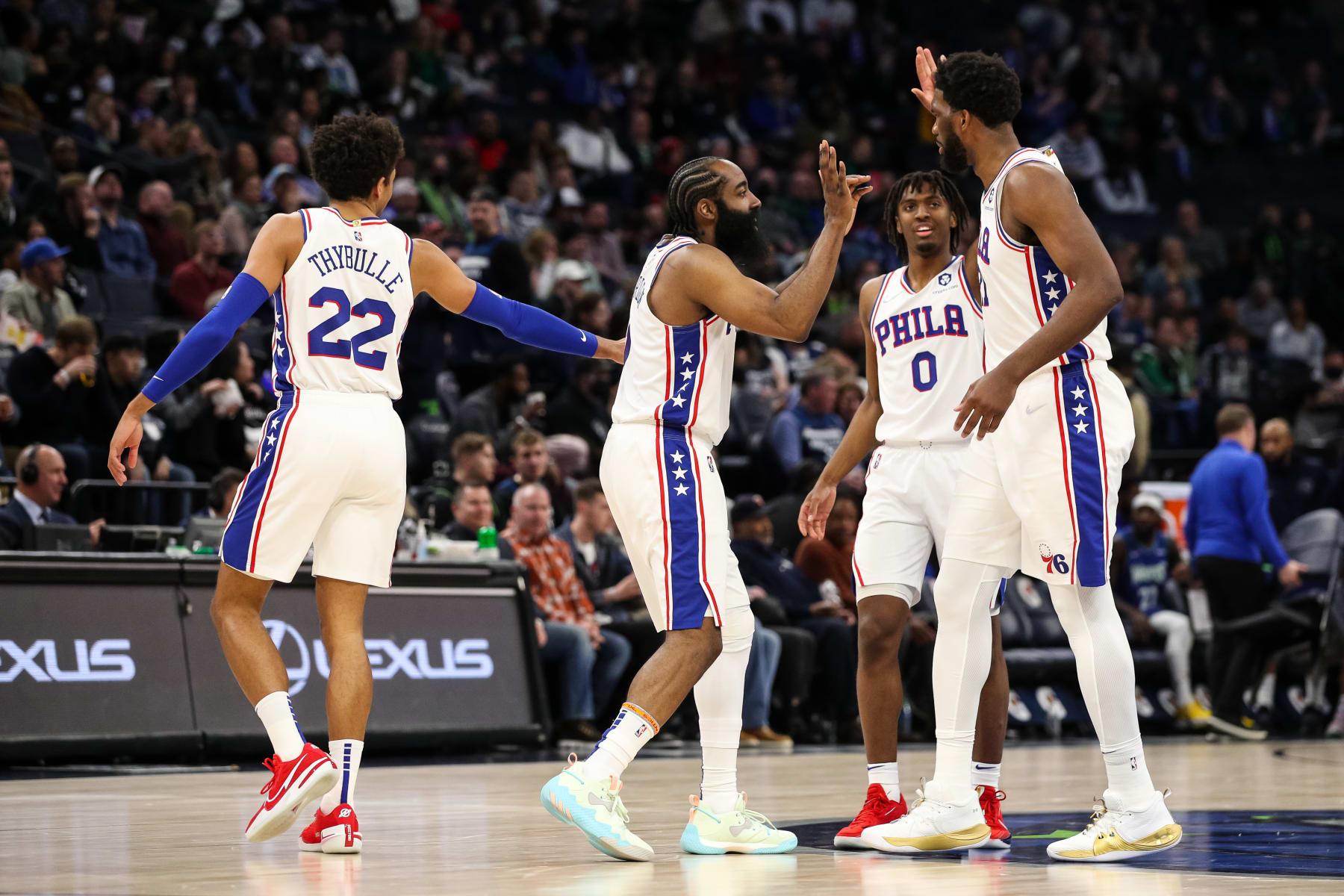 MINNEAPOLIS, MN - FEBRUARY 25: (L-R) Matisse Thybulle #22, James Harden #1, Tyrese Maxey #0, and Joel Embiid #21 of the Philadelphia 76ers high five during a time out against the Minnesota Timberwolves in the third quarter of the game at Target Center on February 25, 2022 in Minneapolis, Minnesota. The 76ers defeated the Timberwolves 133-102. NOTE TO USER: User expressly acknowledges and agrees that, by downloading and or using this Photograph, user is consenting to the terms and conditions of the Getty Images License Agreement. (Photo by David Berding/Getty Images)